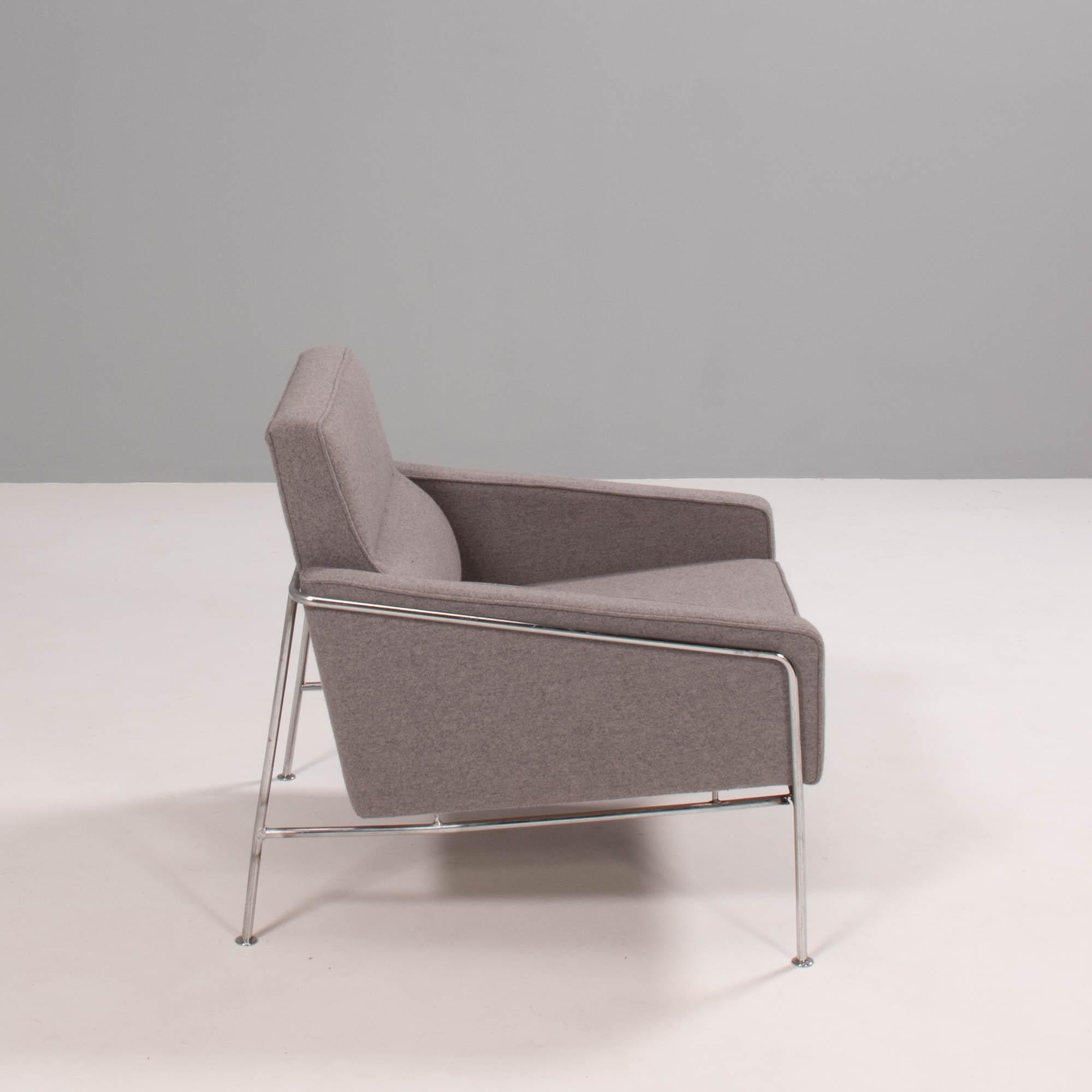 Originally designed by Arne Jacobsen for the SAS Air Terminal in Copenhagen, the Series 3300 chair has a futuristic aesthetic.

Featuring a slim tubular chrome frame, the chairs are upholstered in grey fabric with angular armrests and a padded