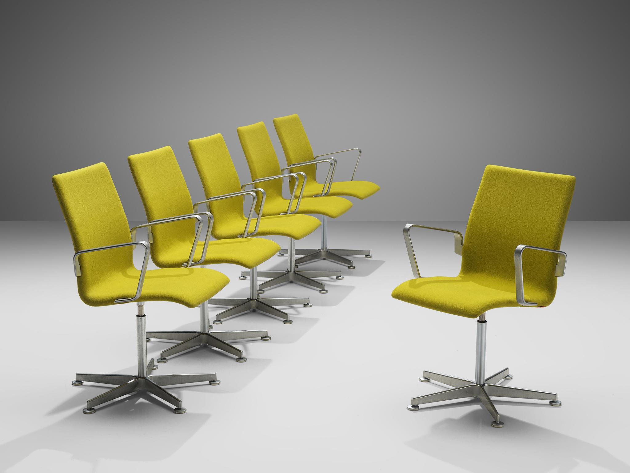 Arne Jacobsen for Fritz Hansen, set of 'Oxford' chairs, metal, yellow fabric, Denmark, design 1965, production later

These classic executive office chairs feature a medium high back (as opposed to the models with a low and a very high back), swivel