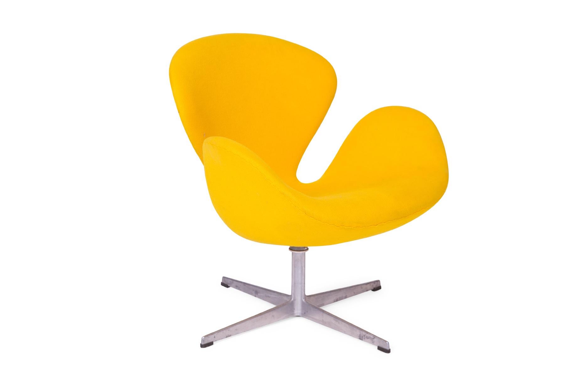Arne Jacobsen for Fritz Hansen all original swan chair, circa early 1960s. This example is upholstered in its original lemon yellow that has only light age appropriate wear. Foam is in excellent condition.