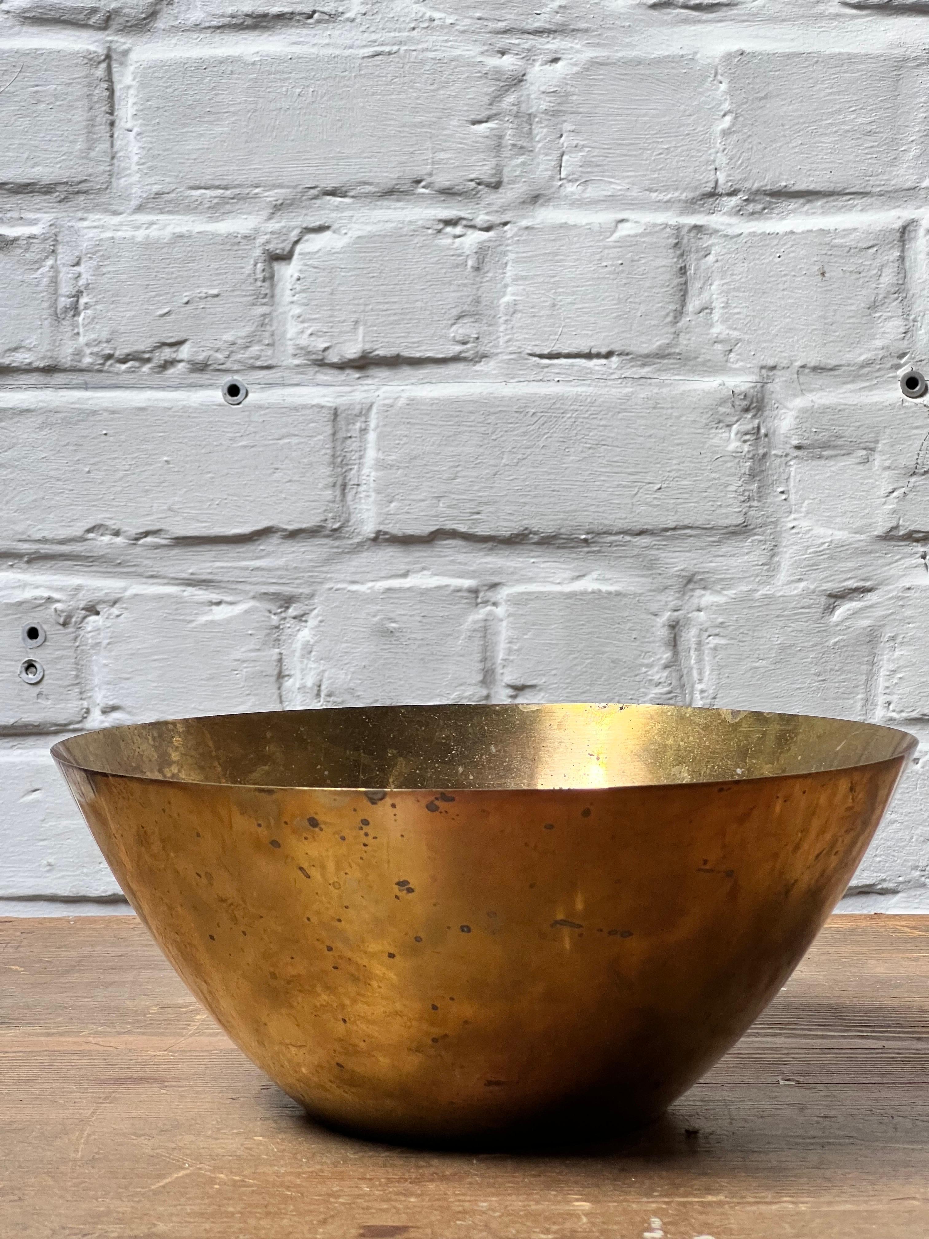 Original brass bowl by master Danish architect Arne Jacobsen. Model designed for Stelton a danish manufacturer . Lots of patina and traces of use that gives a warm feeling. Properly used but a real eye catcher in any interior.