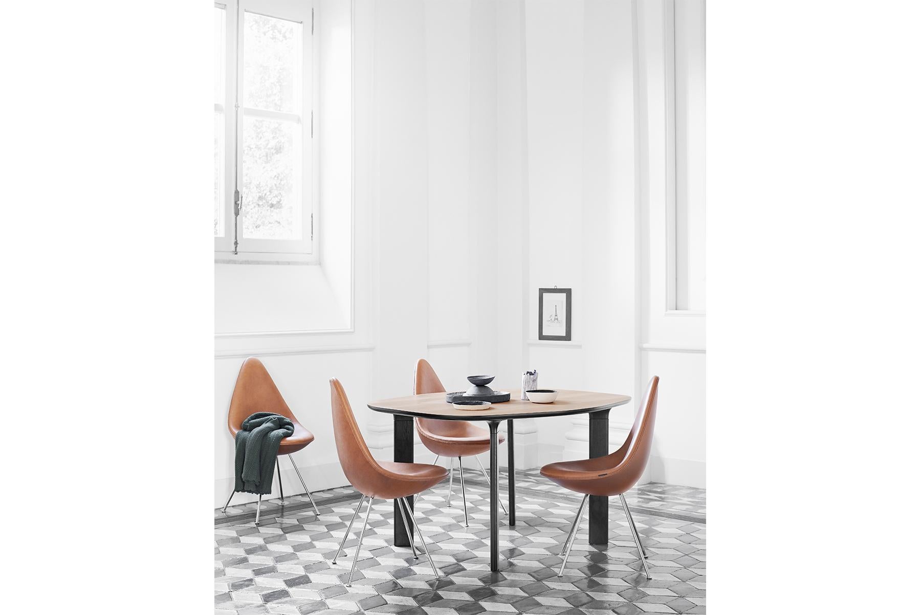 The fully upholstered Drop™ blends elegantly into a wide variety of settings as a great example of furniture design that is able to influence and elevate an entire room by its mere presence and beauty. Arne Jacobsen originally designed it for the