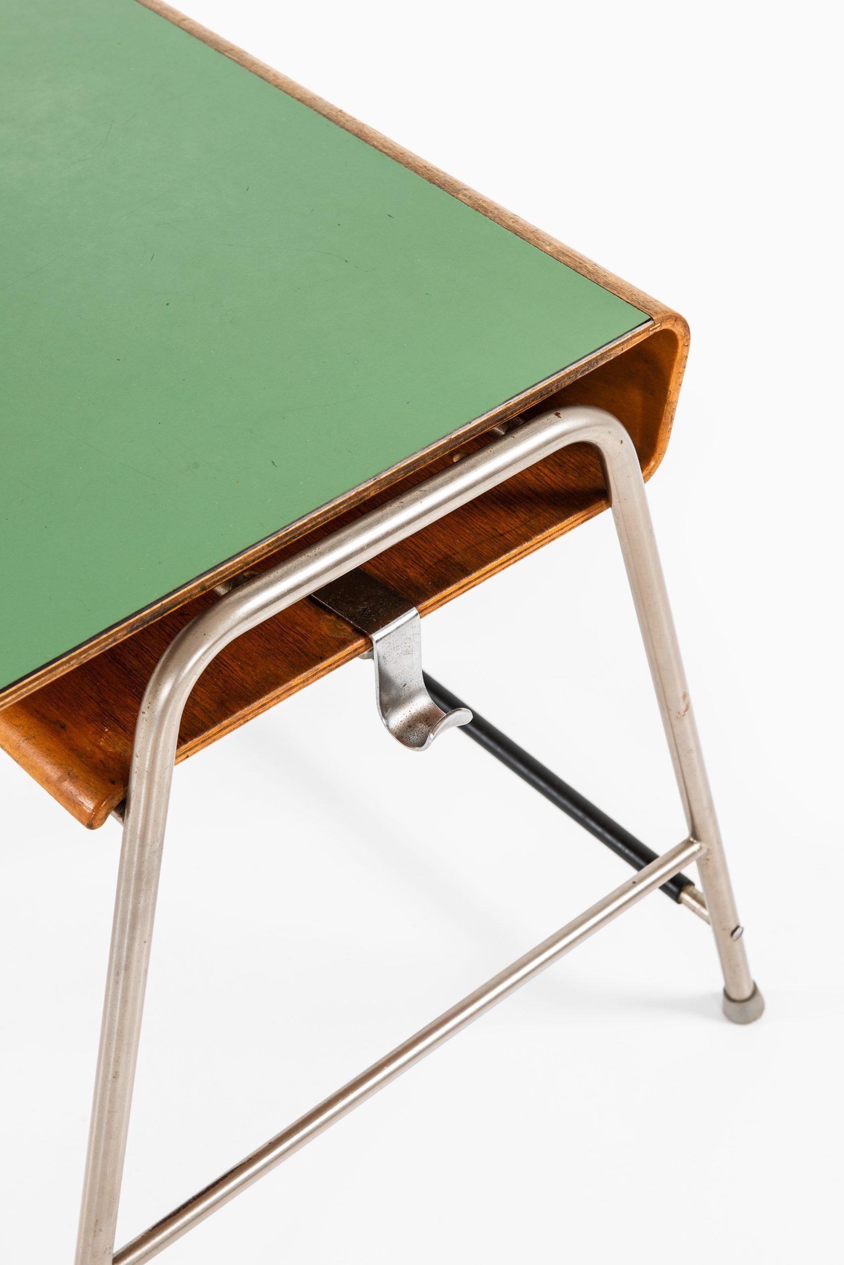 Rare Munkegaard school desk designed by Arne Jacobsen. Produced by Fritz Hansen in Denmark.