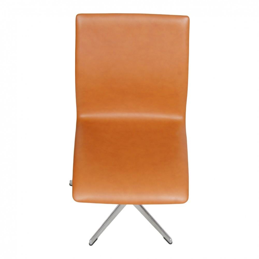 These Oxford chairs are used and appear newly upholstered in Cognac classic leather and fitted with new foam. The chairs appear with a hard back and without defects, however, they can appear with few traces of wear on the frame. The chairs are