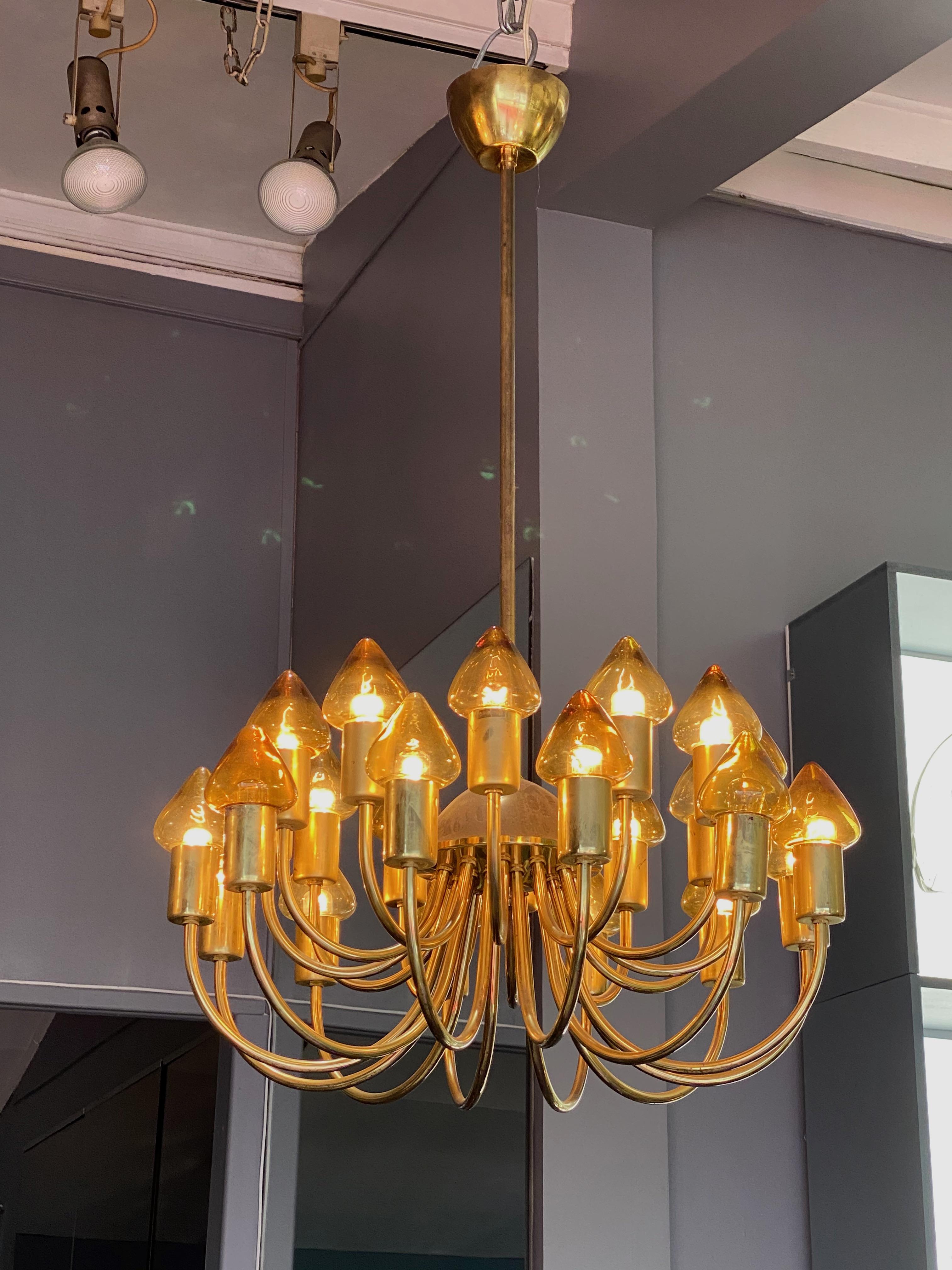 Arne Jacobsen : Pair of Scale Brass Chandelier 
Unusual 60 cm in diameter chandelier with 24 fyellow glass shades by Arne Jacobsen - Denmark circa 1950's.
one yellow shade missing