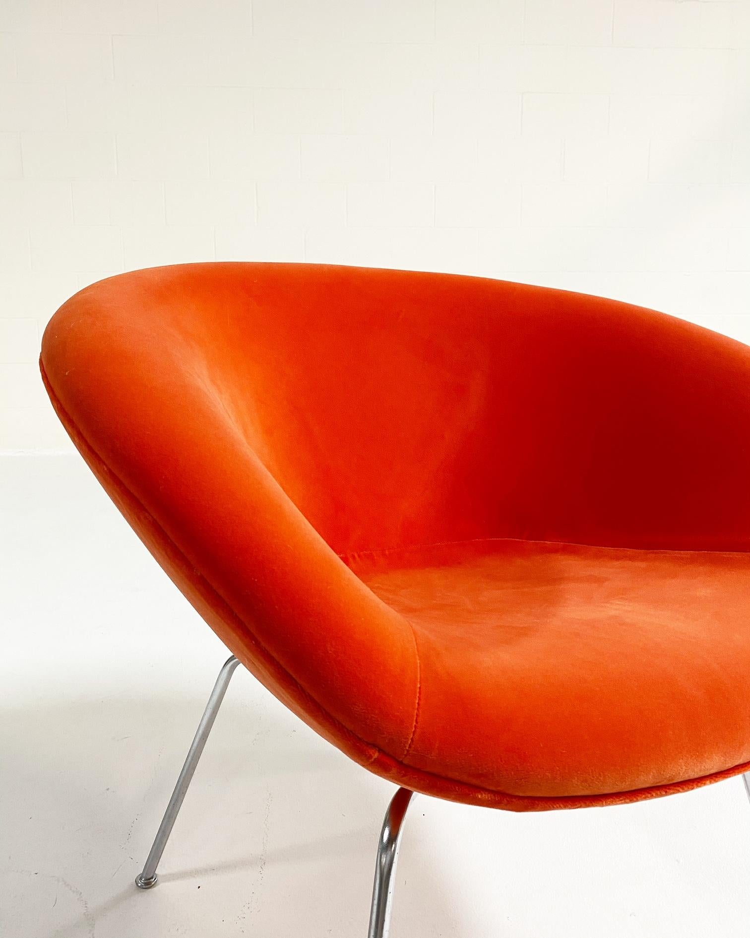 Arne Jacobsen was a true visionary as an architect and designer, and his Pot chair is a little gem of mid-century designs. Restored in a playful pop orange velvet by Loro Piana, this chair is perfect for a fun burst of color in any room.