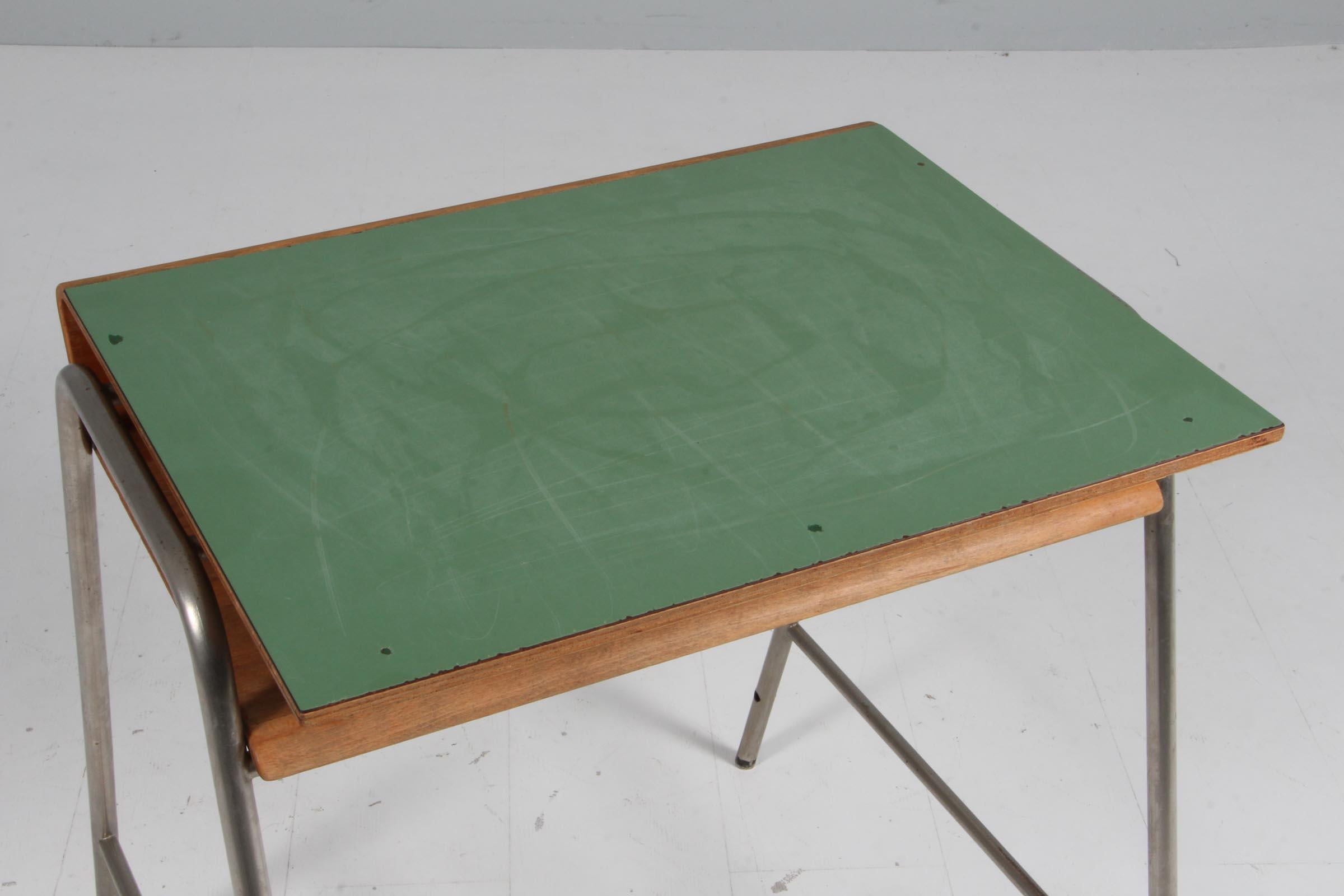 Arne Jacobsen Munkegaards School table with frame of steel. Top of beech and laminate. 

Arne Jacobsen made all the interior for the Munkegaards School table