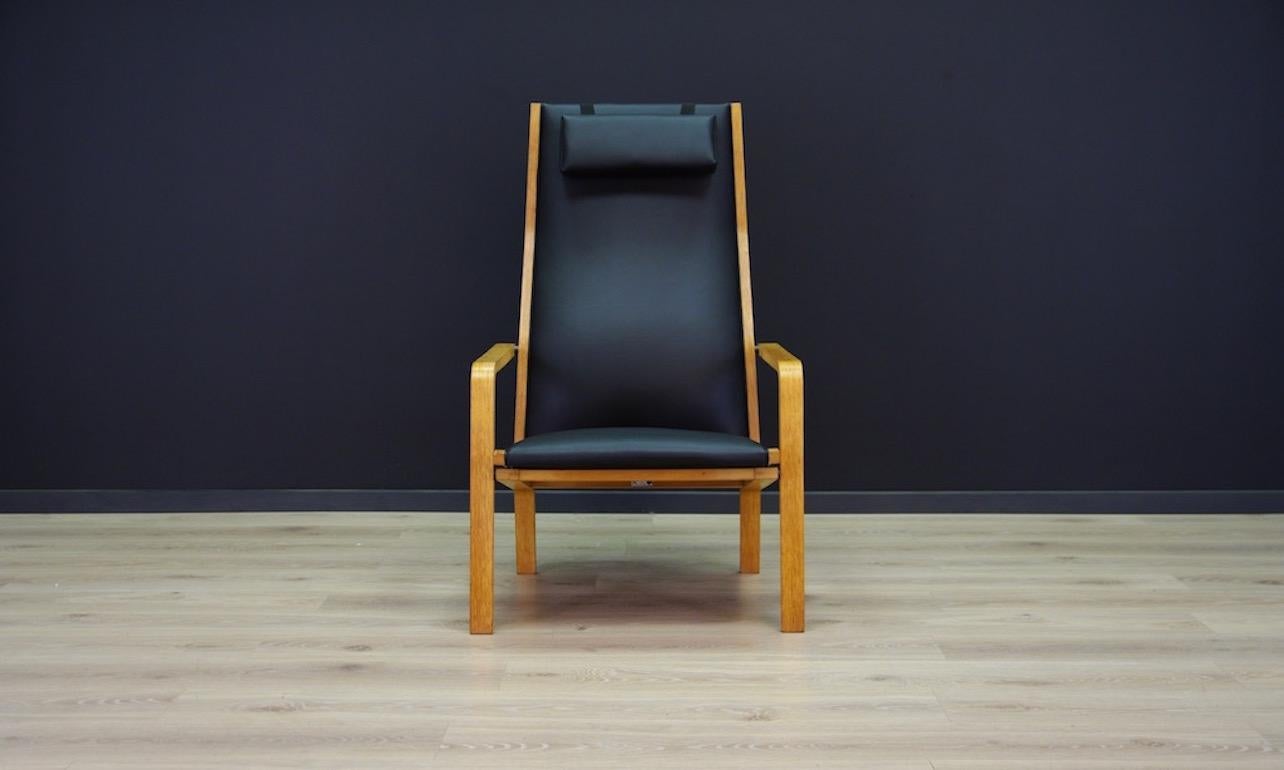 Armchair from the 1960s-1970s. Minimalist form designed by a leading Danish designer Arne Jacobsen. Beautiful straight line, model 4335 from manufactory Fritz Hansen. Armchair upholstered with the new Eko leather. Construction of ashwood. Armchair