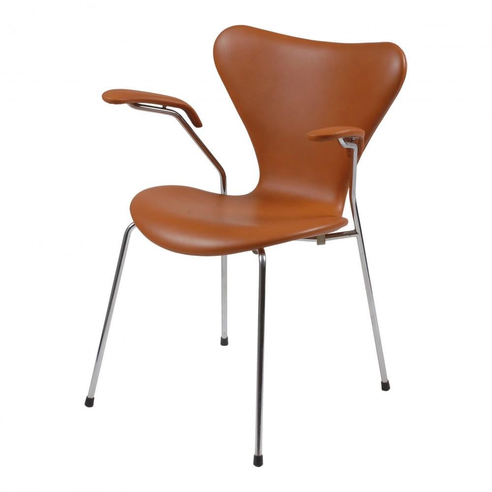 50 pieces in stock! 
These seven chairs are used and are newly upholstered with cognac classic leather and fitted with a new foam cushion. 

The chairs are have solid backs and no defects. The chairs are original and manufactured by Fritz Hansen.
