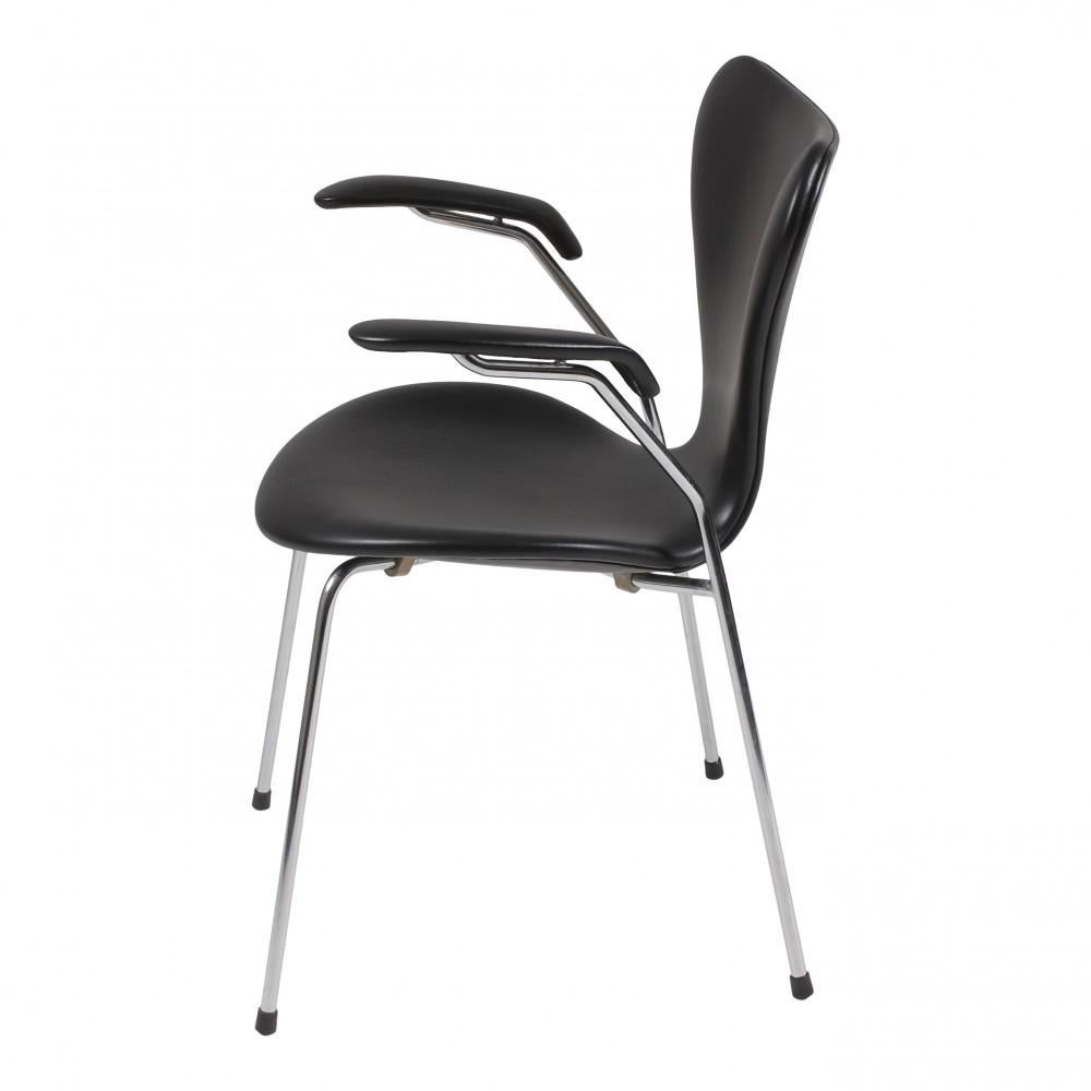 50 pieces in stock
These seven chairs are used and are newly upholstered with black classic leather and fitted with a new foam cushion. 

The chairs have solid backs and no defects. The chairs are original and manufactured by Fritz Hansen. The