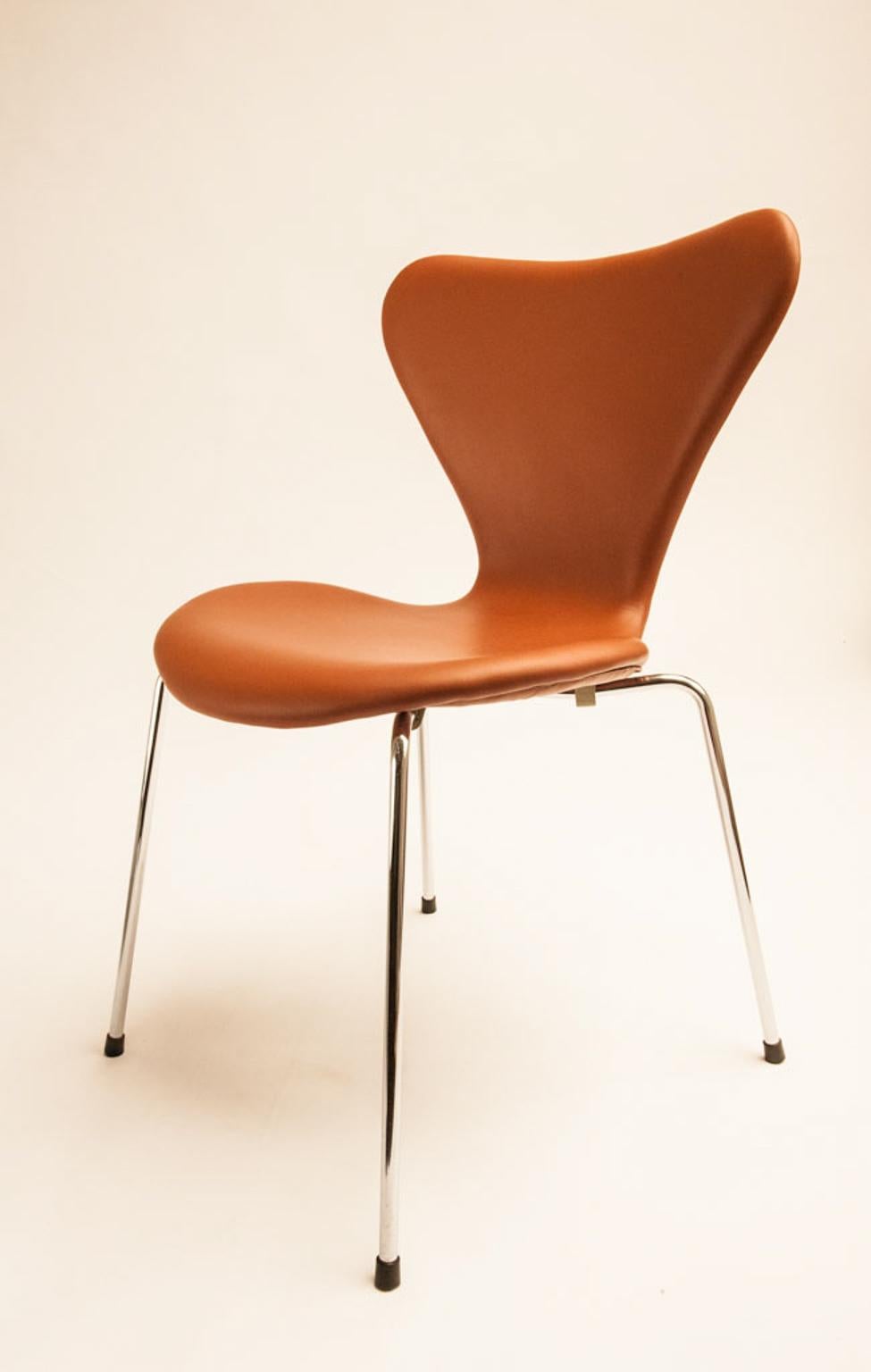 Seven chair, model 3107. Set of six chairs in molded plywood shell, with chromed tubular steel frame. Designed in 1955. Manufactured by Fritz Hansen. Professionally reupholstered in cognac-colored semi-aniline leather from Arne