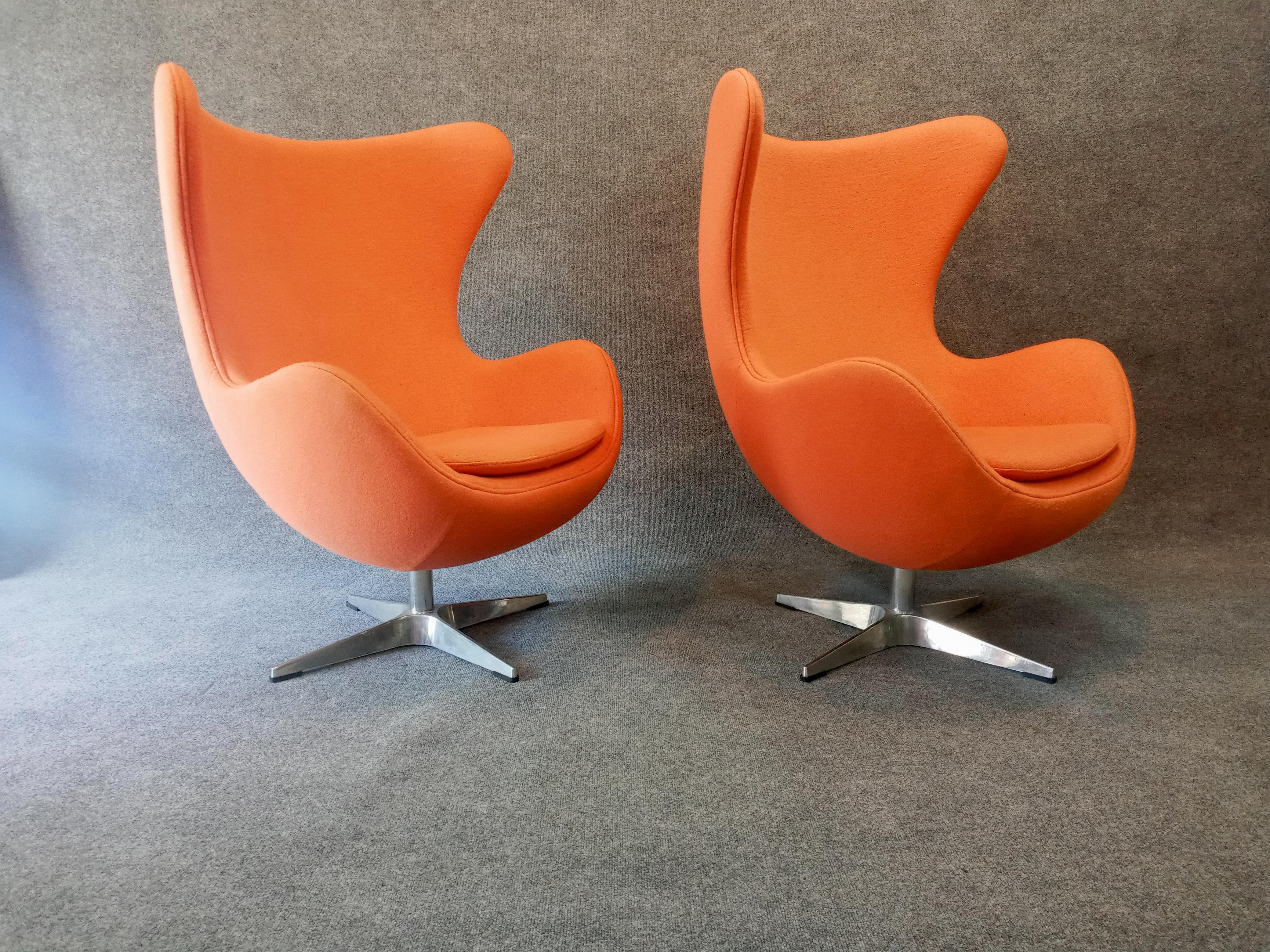 1960s styling paired with contemporary manufacturing quality and condition, this bright orange chairs are very comfortable with the tilt and swivel feature. In textured fabric with bright metal bases, chairs are clean, present well and highly