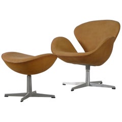 Arne Jacobsen Swan Chair and Ottoman, Newly Reupholstered in Tan Leather, 1964