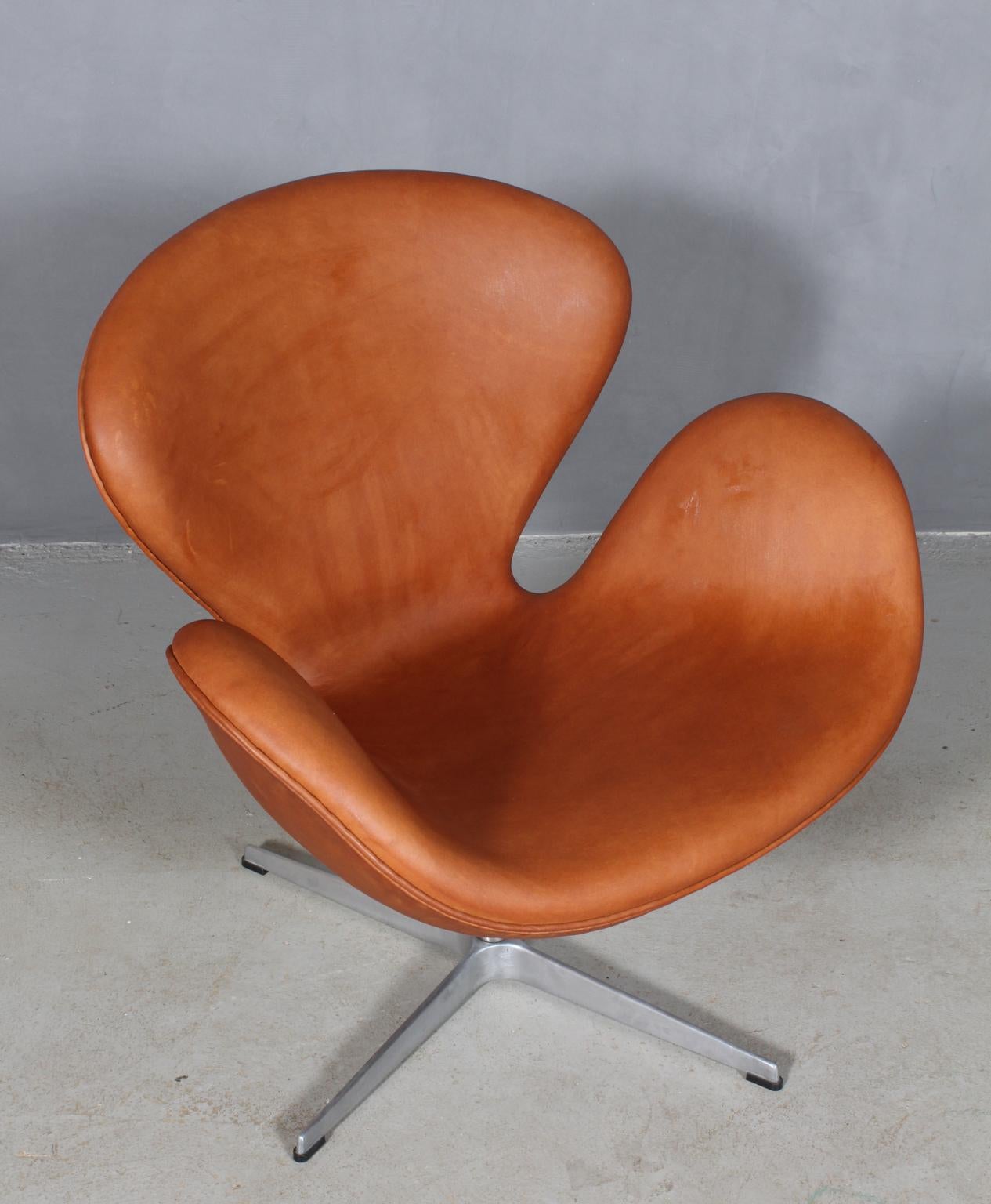 The swan chair, new upholstered in cognac aniline leather. 

Fritz Hansen. 1981. 

Upholstered in Denmark in 2019 with aniline leather. 

This iconic chair is one of the most famous chairs in the world and is recognized by design lovers in all