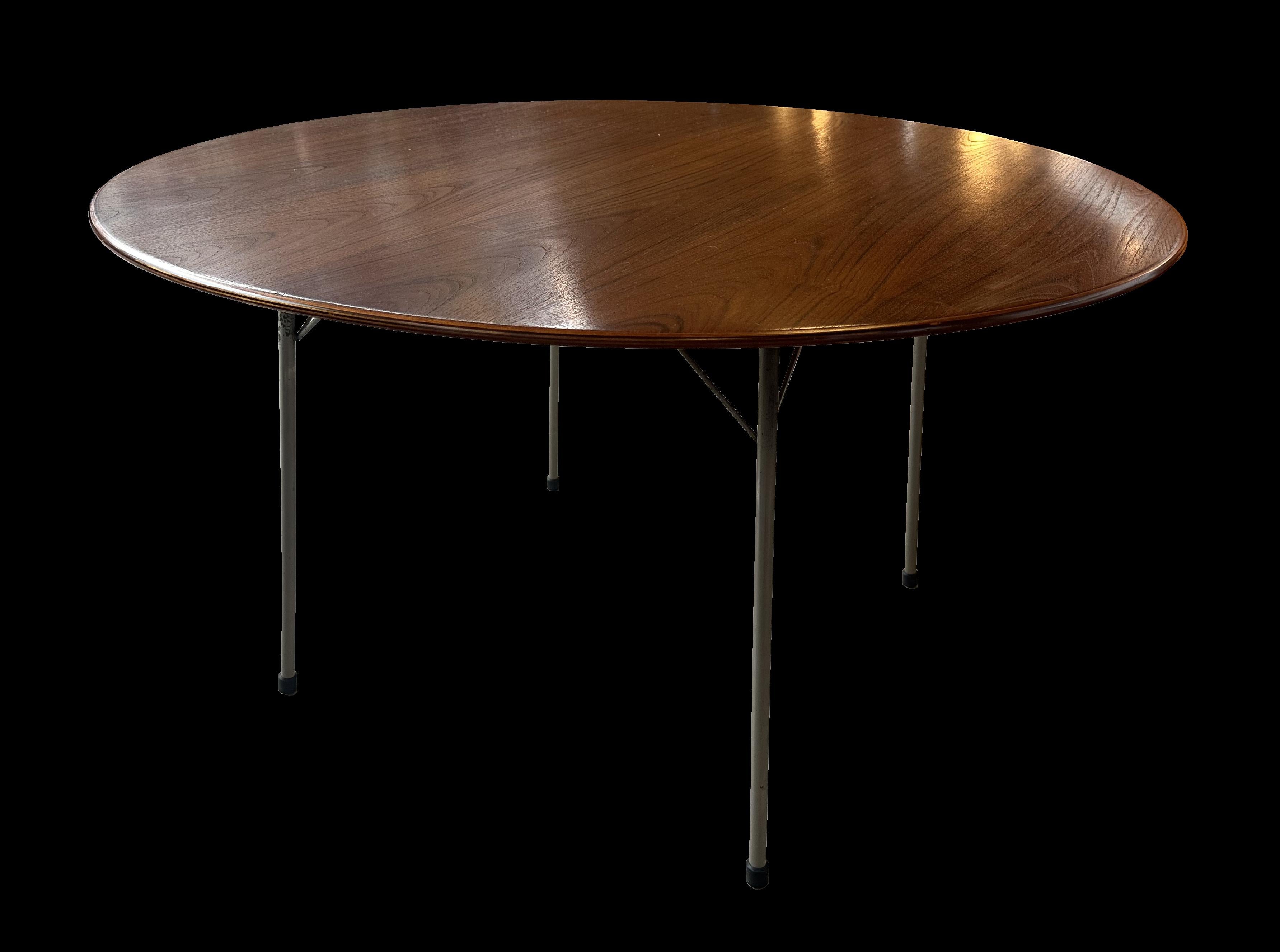 This is an early original version, designed by Arne Jacobsen and Made by Fritz Hansen, and retaining it;s original Ivorine Retailers label from Heal's of Tottenham Court Road London.