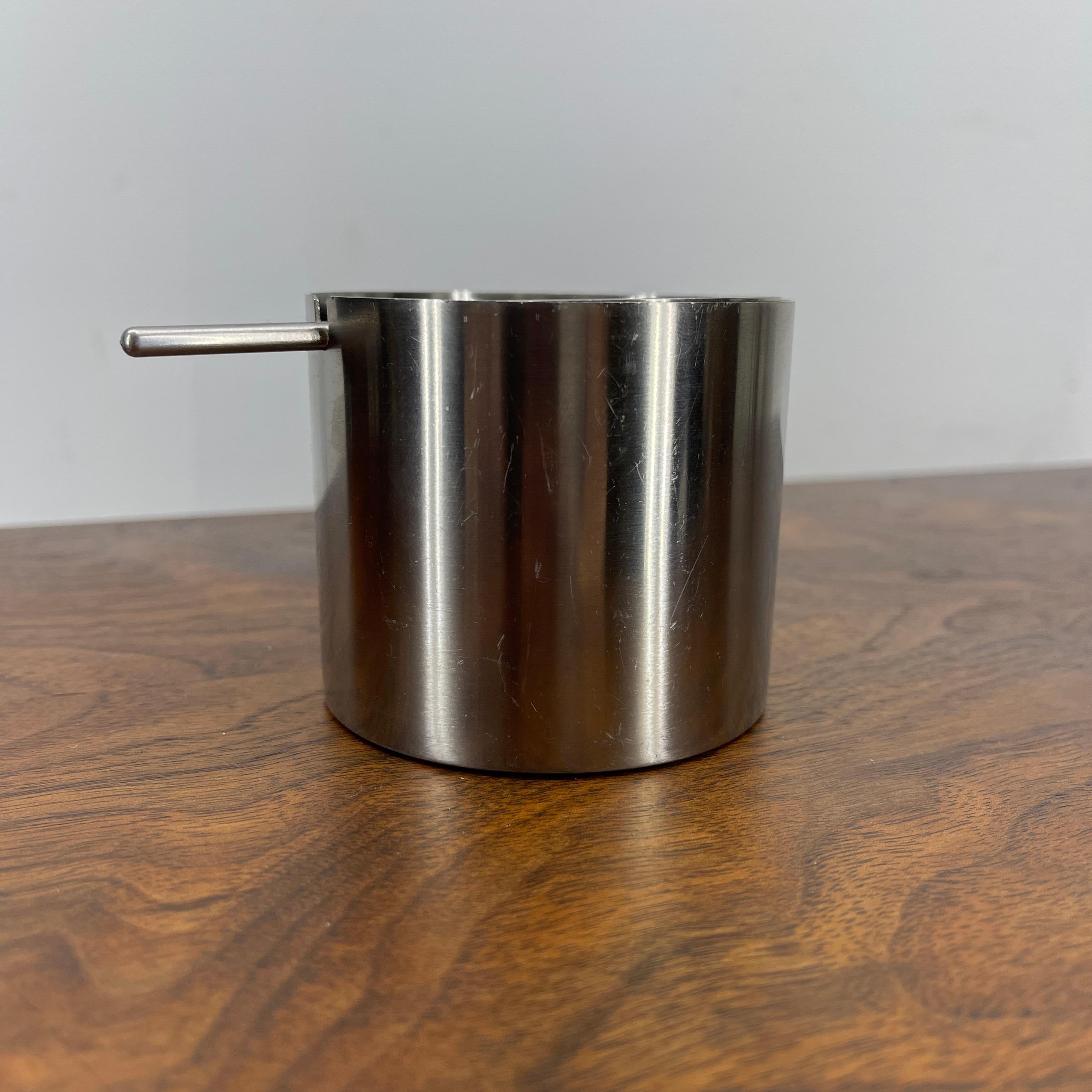 Arne Jacobsen stainless steel cylinda series ashtray for Stelton.
Mid-Century Modern classic Danish ashtray. The ashtray is beautiful in it's simplicity. The stainless steel glows. The ashtray is as functional as it stylish.