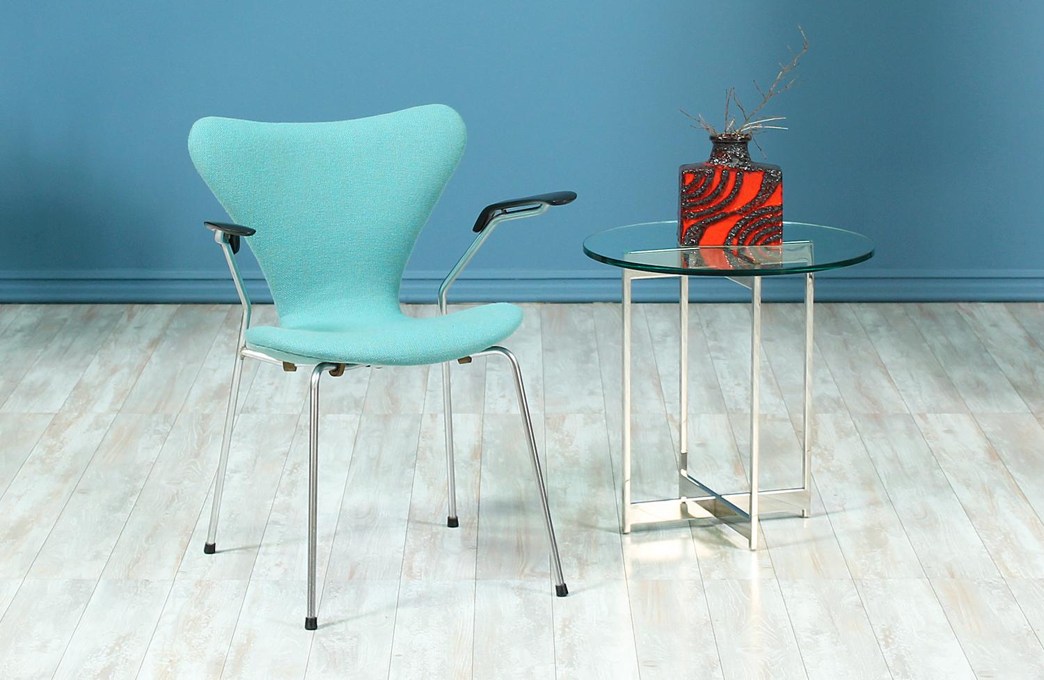 Series-7 Desk Chair designed by Arne Jacobsen for Fritz Hansen in Denmark circa 1950’s. Worldly recognized as one of Jacobsen’s most iconic designs, this chair features a chromed steel body newly upholstered in a soft cyan blue tweed fabric with