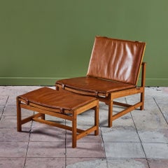Arne Karlsen and Peter Hjort Leather and Cane Lounge Chair and Ottoman