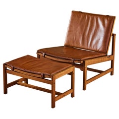Arne Karlsen and Peter Hjort Leather and Cane Lounge Chair and Ottoman