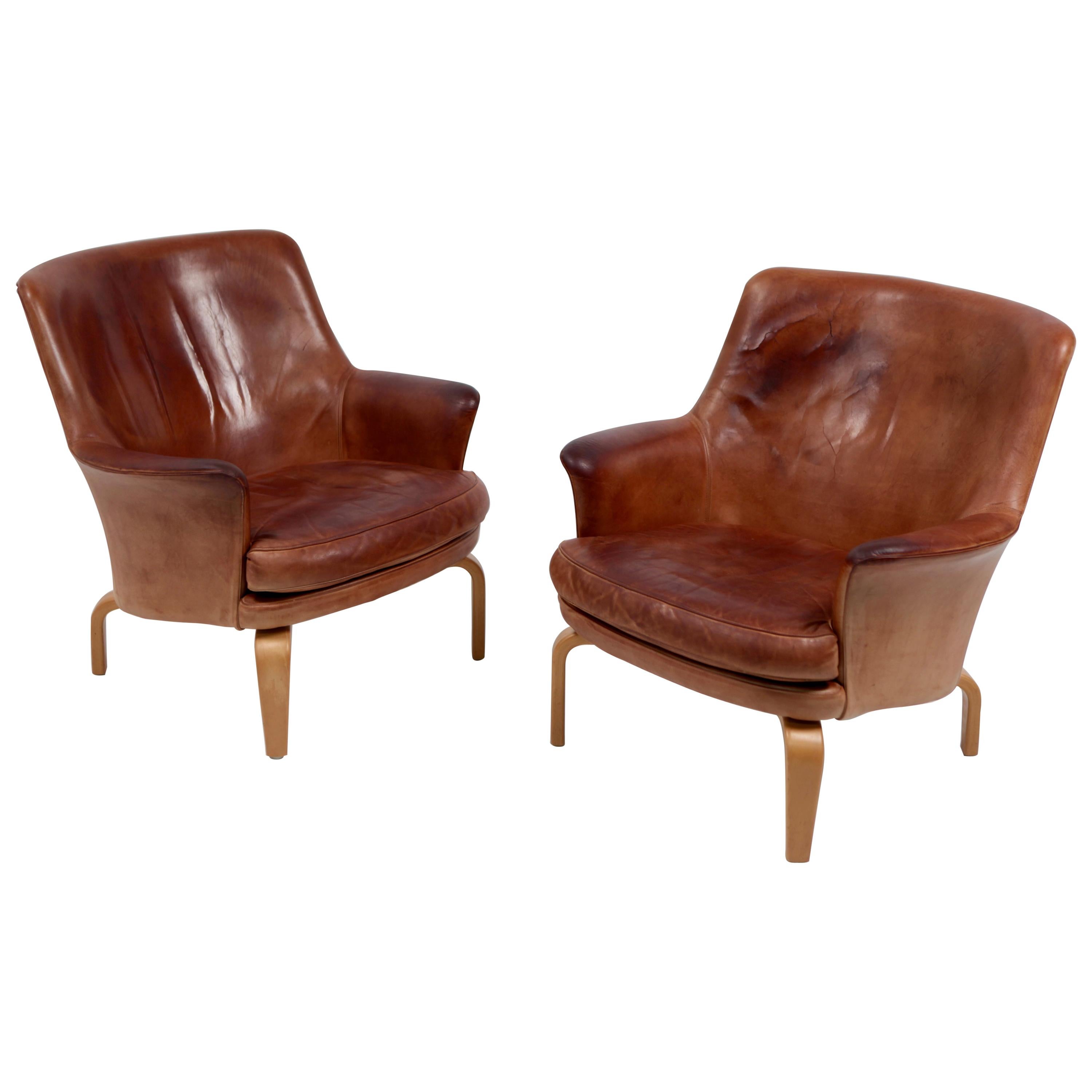 Paire de fauteuils Pilot d'Arne Norell, en cuir et hêtre, Suède, 1967
