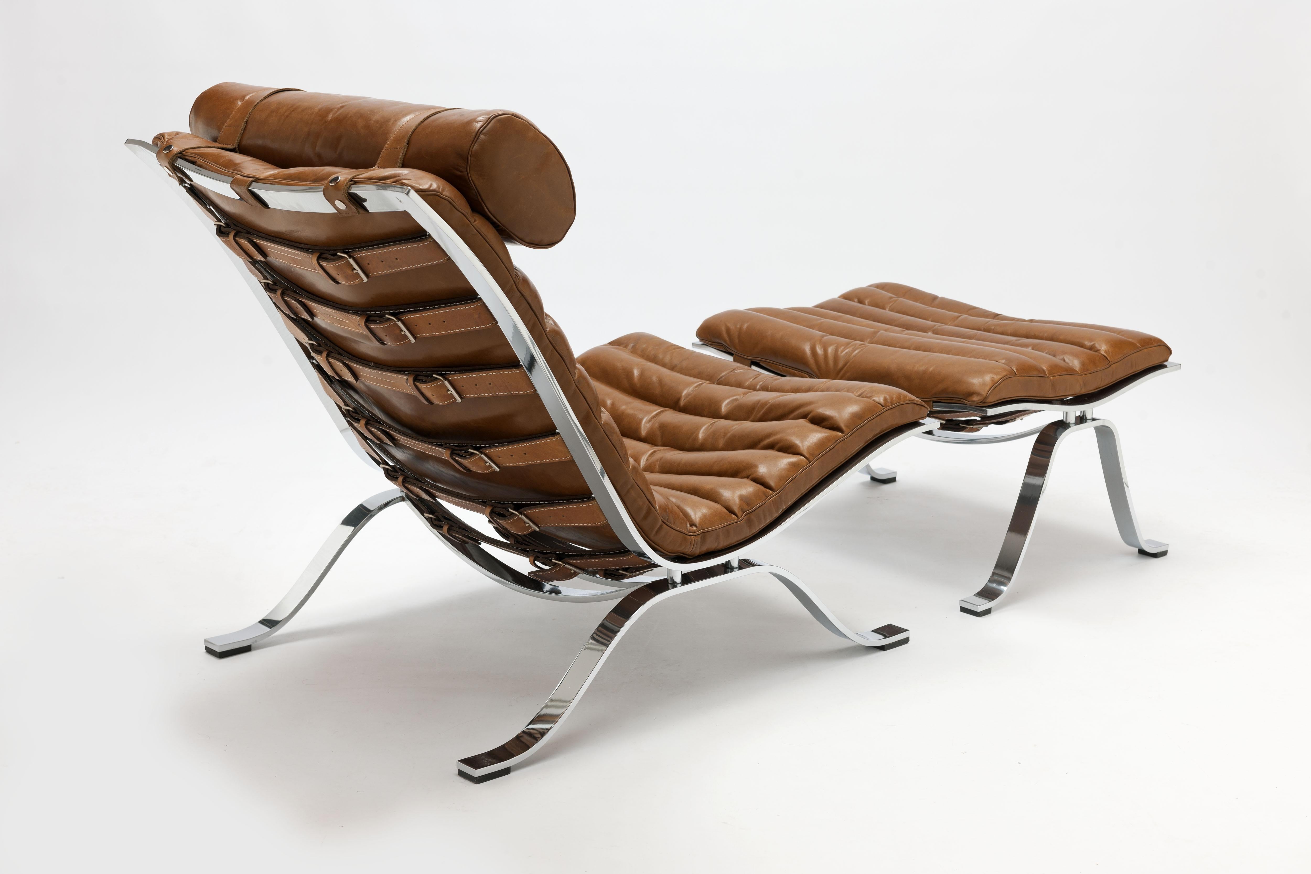 Vintage Ari lounge chair and ottoman with beautiful high gloss chrome steel frame designed by Swedish designer Arne Norell in 1966. One of the most timeless iconic and most comfortable designs of the 20th century. This vintage lounge chair and