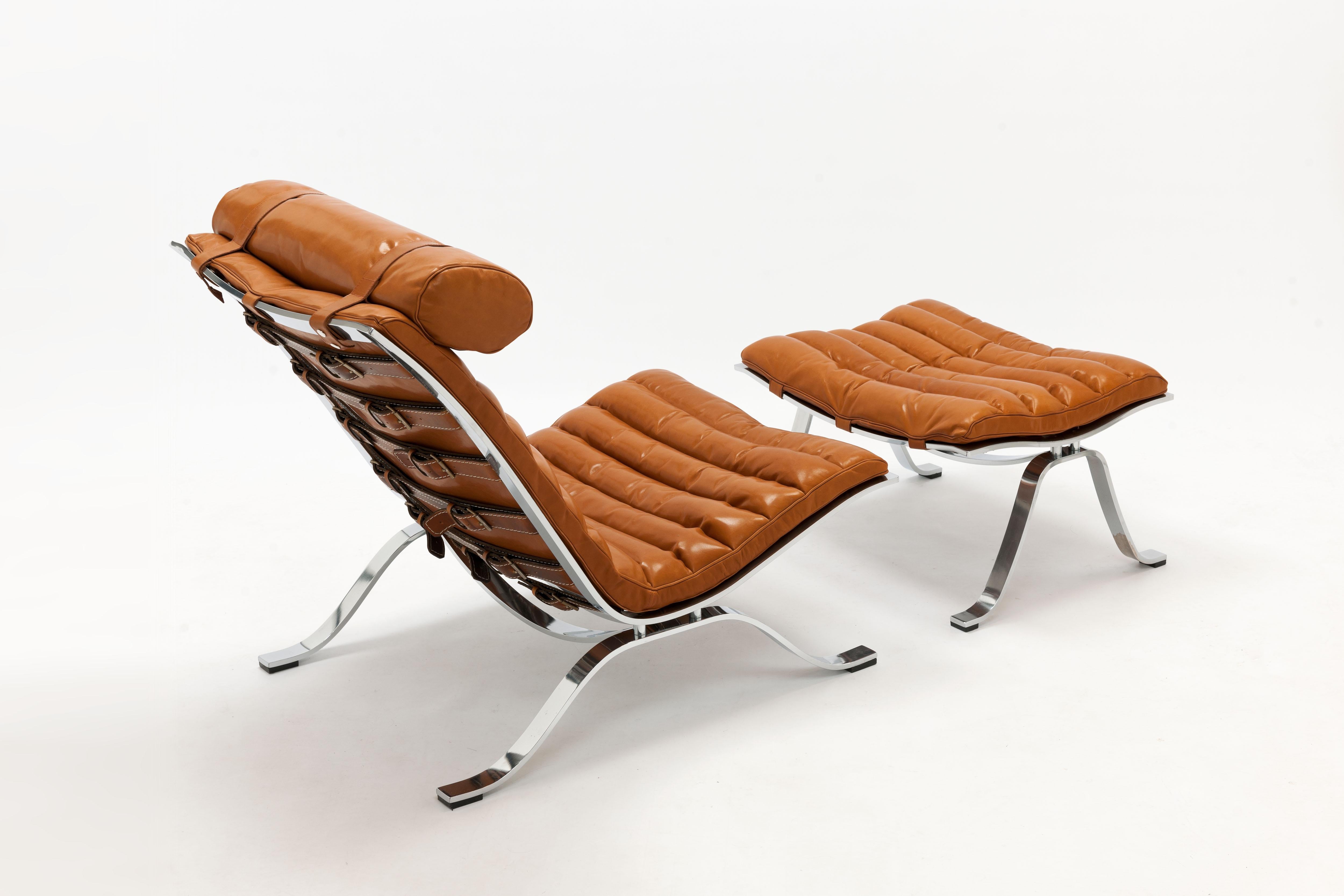 Vintage Ari lounge chair and ottoman with high gloss chrome steel frame designed by Swedish designer Arne Norell in 1966. One of the most timeless iconic and most comfortable designs of the 20th century.

This vintage lounge chair and footstool are