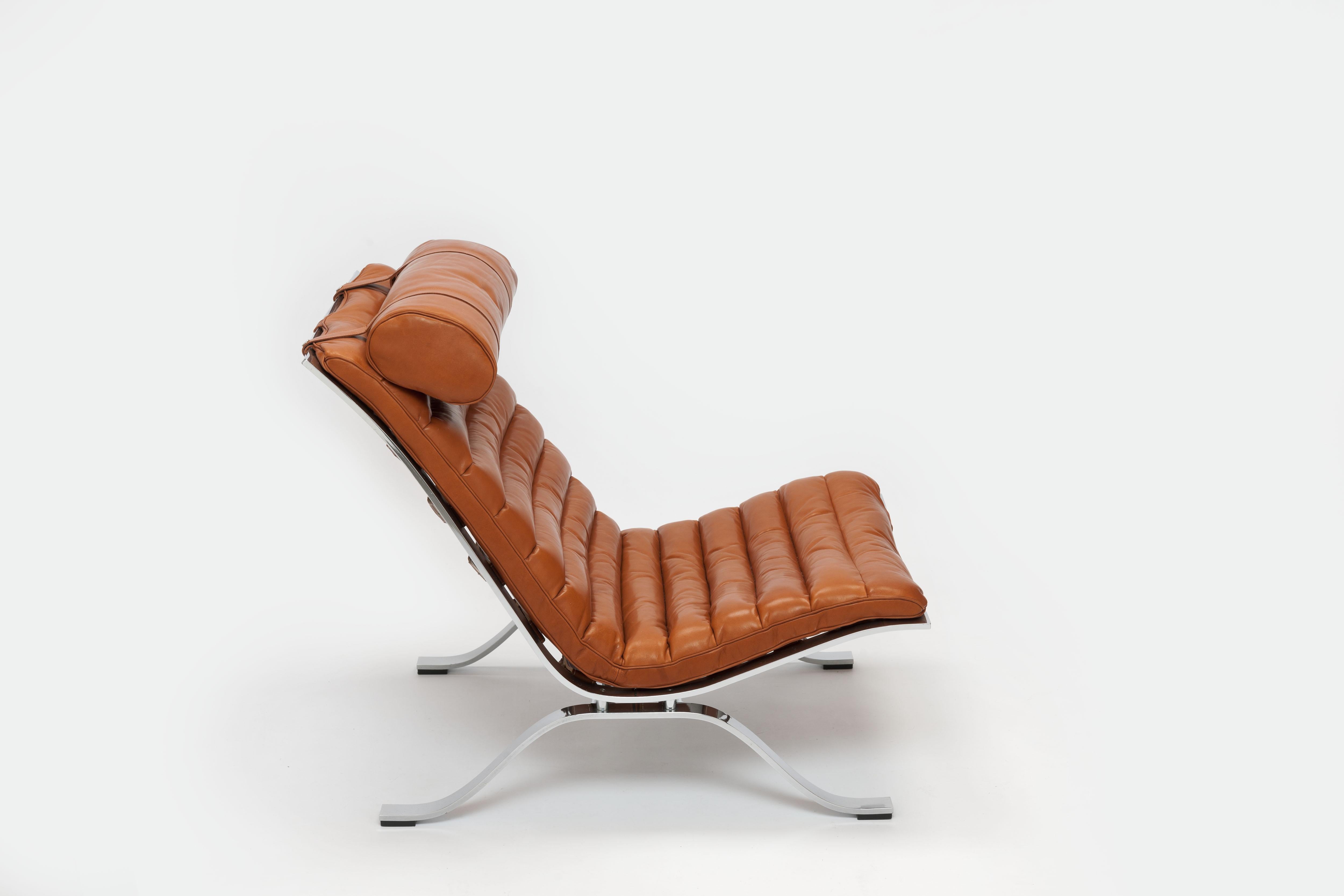 Low slung steel framed leather 'Ari' Lounge chair by Swedish designer Arne Norell from 1966. 
This vintage lounge chair comes with new upholstery (priced accordingly), executed in a cognac color leather, which is made by the original manufacturer