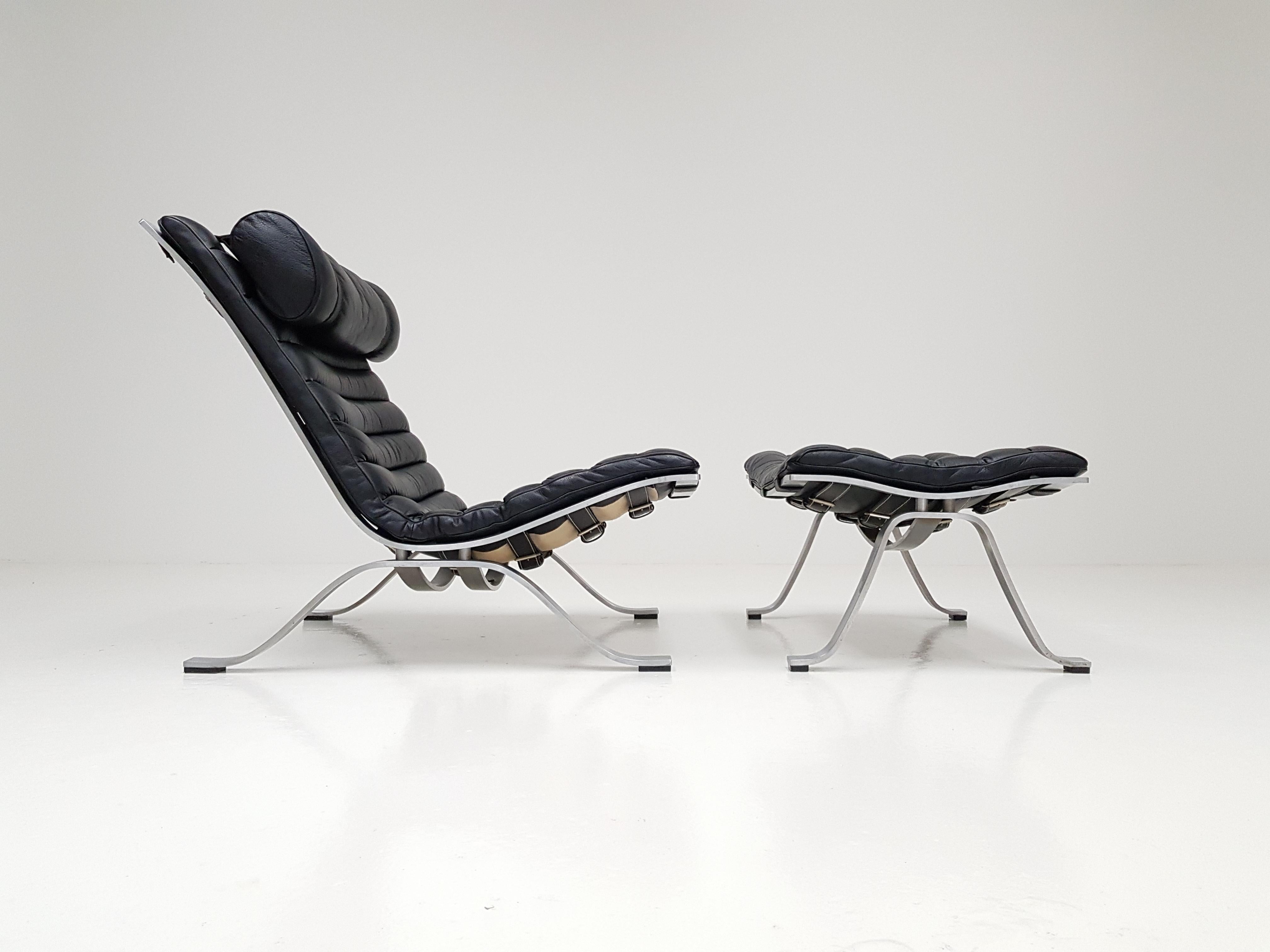 An Arne Norell 'Ari' lounge chair with ottoman designed in 1966 and produced by Norell Mobel. 

Arne Norell (1917–1971) was an Iconic Swedish furniture designer.

The chair sits low and allows for very comfortable reclining. Common with Arne