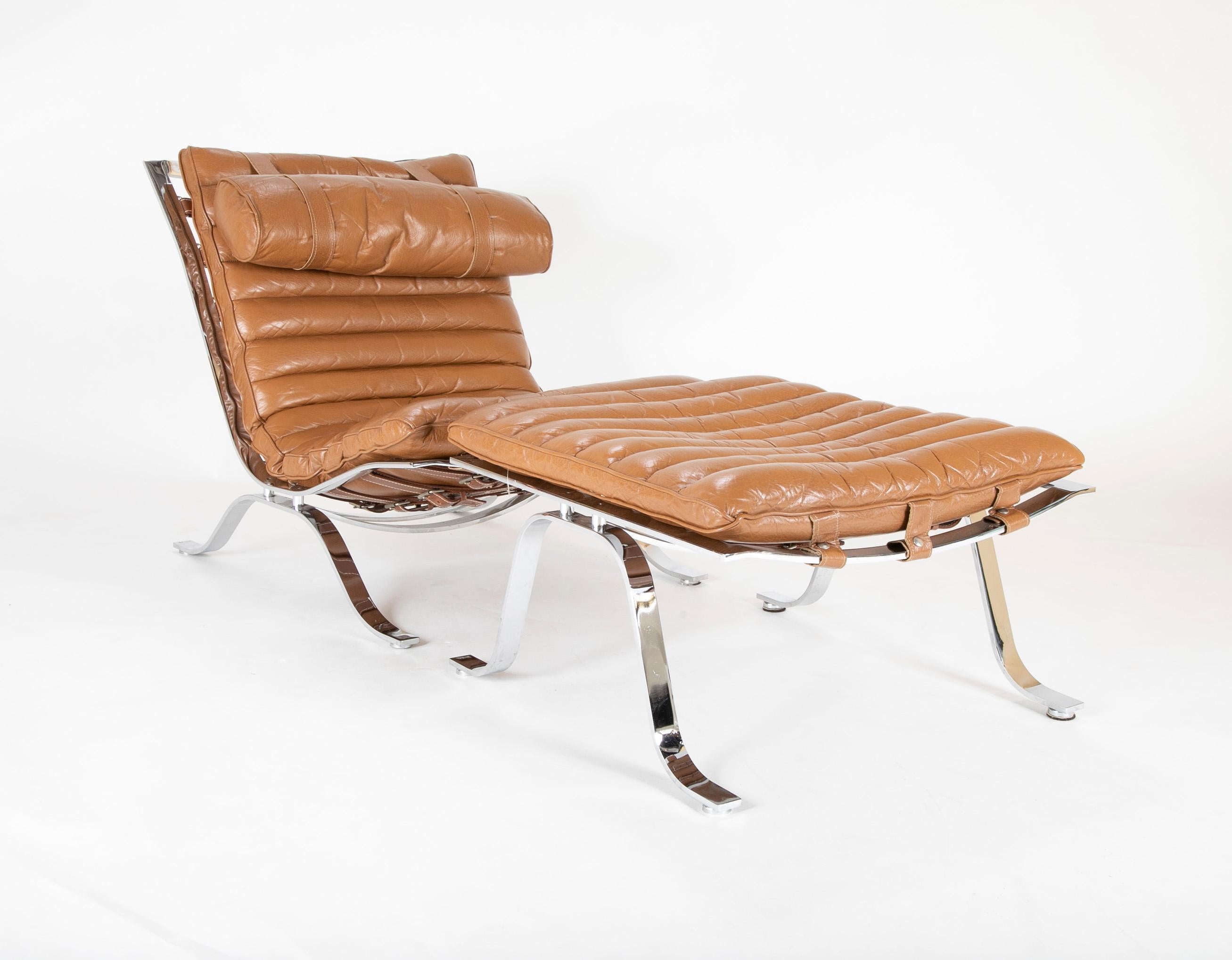 Chrome-plated steel and leather channeled cushion. Ari lounge chair with ottoman by Arne Norell,

circa 1966.
