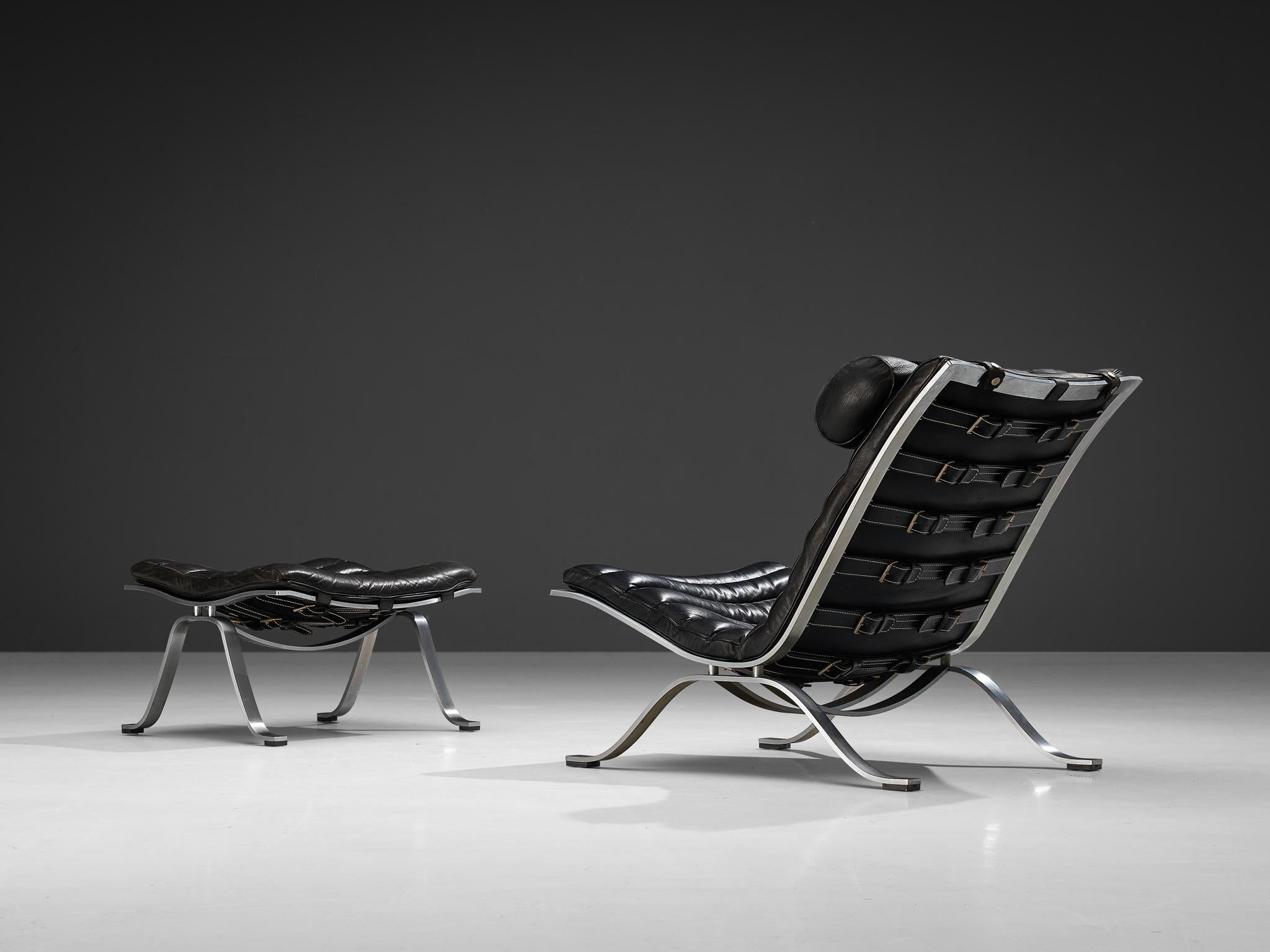 Arne Norell for Norell Møbel AB, 'Ari' lounge chair and ottoman, black leather, chrome-plated steel, Denmark, 1966

This lounge chair is designed by Arne Norell. This chair, model Ari, comes with a footstool. The whole frame is executed in