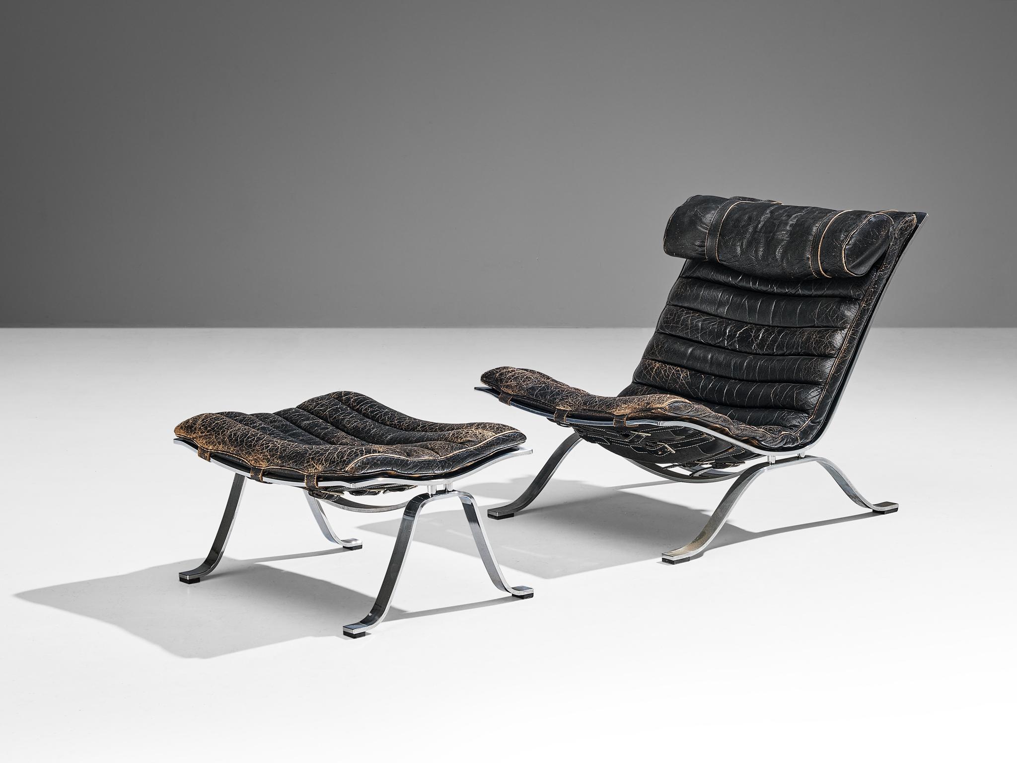 Arne Norell for Norell Møbel AB, 'Ari' lounge chair and ottoman, patinated black leather, chrome-plated steel, Denmark, 1966

The lounge chair and accompanying ottoman, known as the 'Ari' model, were designed by the esteemed Arne Norell