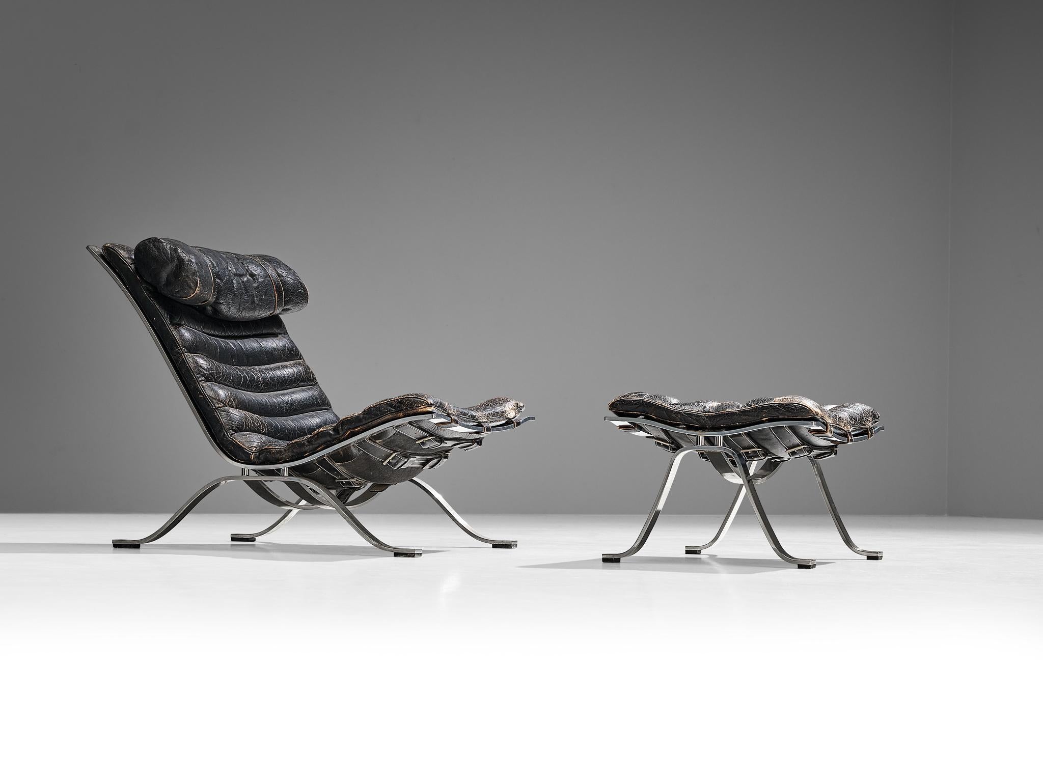 Steel Arne Norell 'Ari' Lounge Chair with Ottoman in Patinated Black Leather For Sale