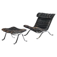 Arne Norell 'Ari' Lounge Chair with Ottoman in Patinated Black Leather