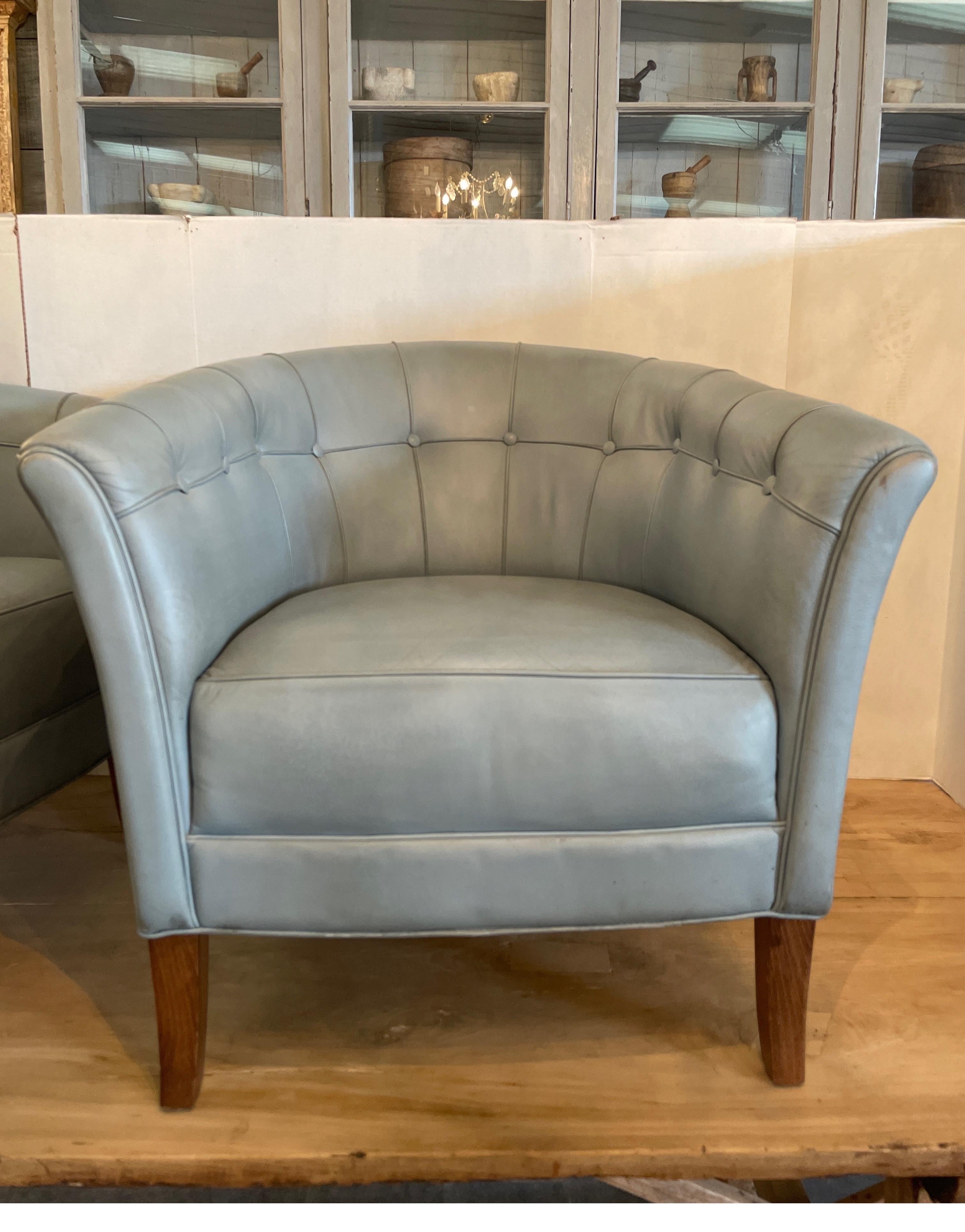 Swedish born designer Arnie Norell born 1917 died 1970s mid century chairs with original leather in a periwinkle blue/grey . These chairs called Lord chairs are very comfortable and in great condition.  The only thing is that the leather is worn by