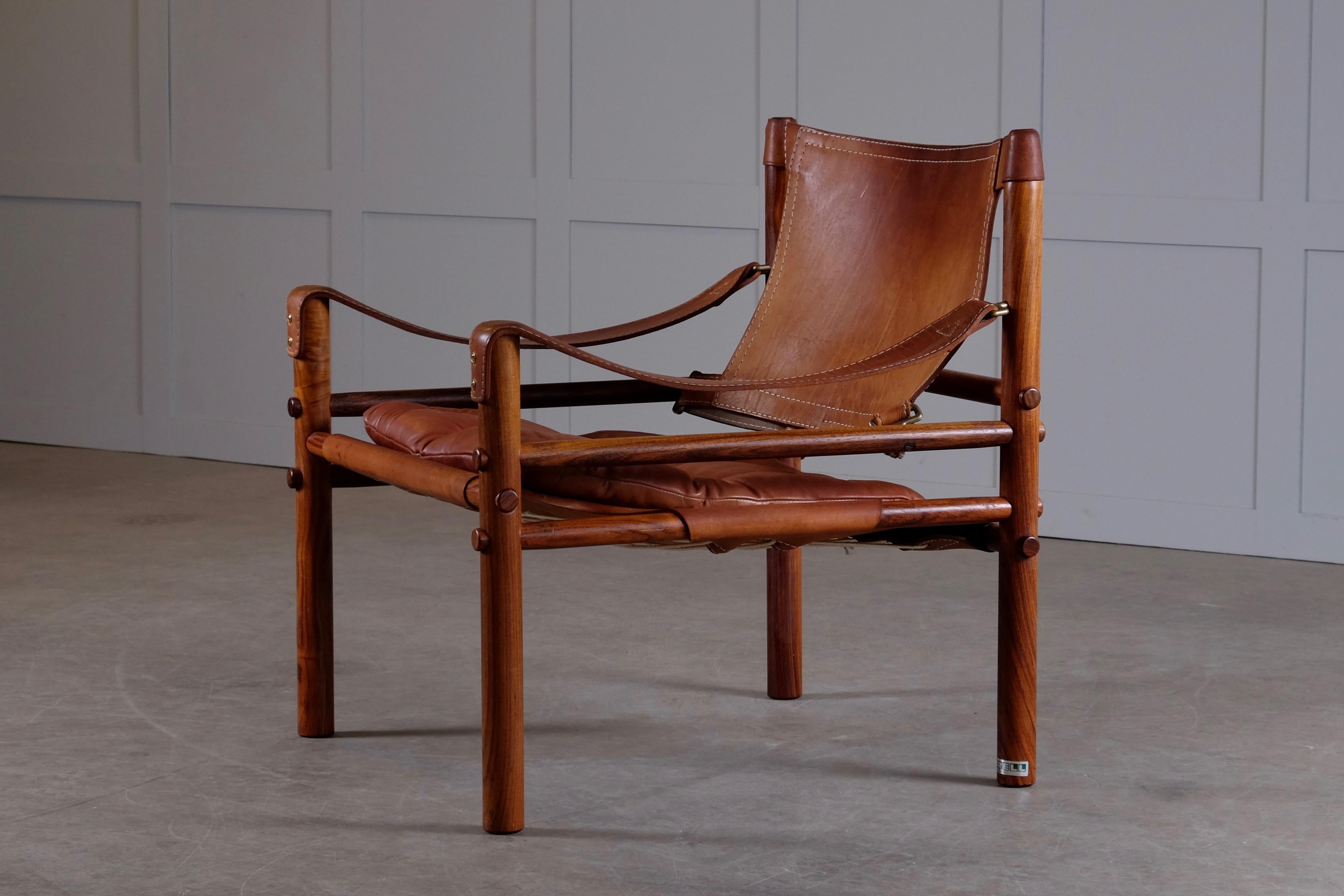 Lovely safari chair / easy chair in leather designed by Arne Norell, 1964, produced by Arne Norell AB in Aneby, Sweden, 1960s.


 