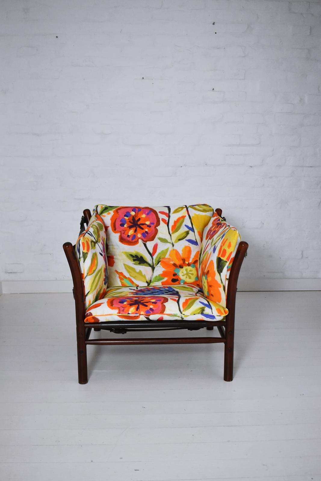 A 1960s 'Ilona' chair by Swedish designer Arne Norell.
Featuring stained beech and saddle leather with 4 loose cushions. Wear consistent with age and use.
Cushions recovered in Josef Frank style canvas fabric.