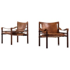 Arne Norell Easy Chairs Model Sirocco in Rosewood and Brown Leather