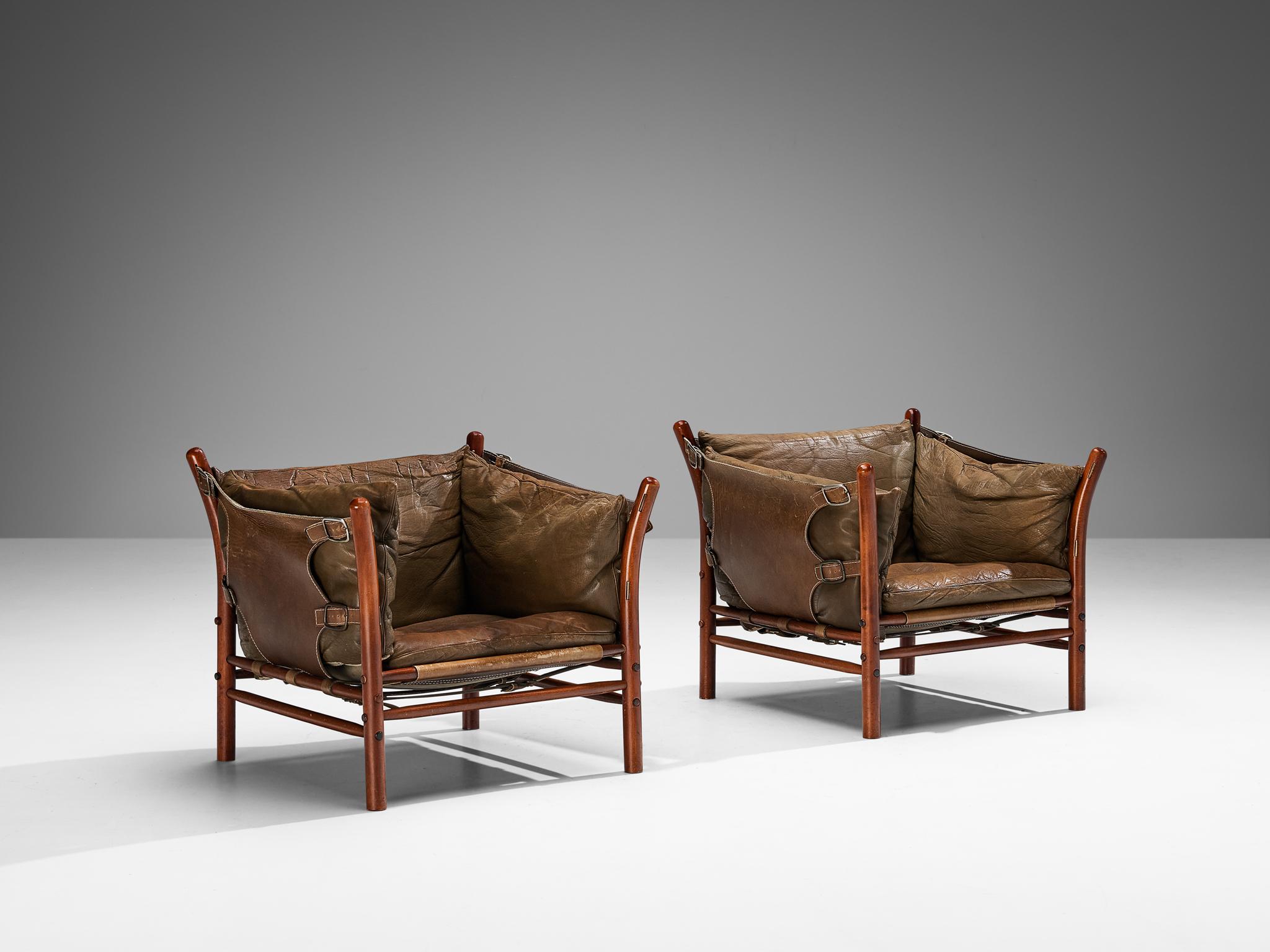 Arne Norell for Norell Möbler AB, 'Ilona' lounge chair, beech, leather, Sweden, 1960s. 

Very nice contrasting pair of easy chairs by Arne Norell designed in the 1960s. These chairs are designed with very thick and rich leather which shows a