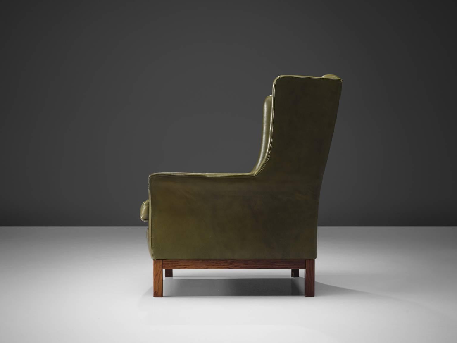 green leather high back chair