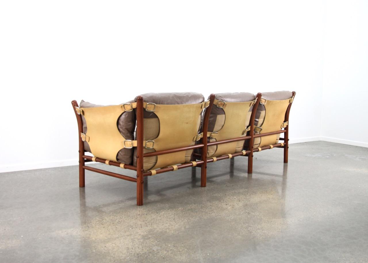 Scandinavian Modern, Arne Norell, designed in 1971, manufactured by Norell Mobel.

Taupe leather seating, natural leather slings, teak frame

                