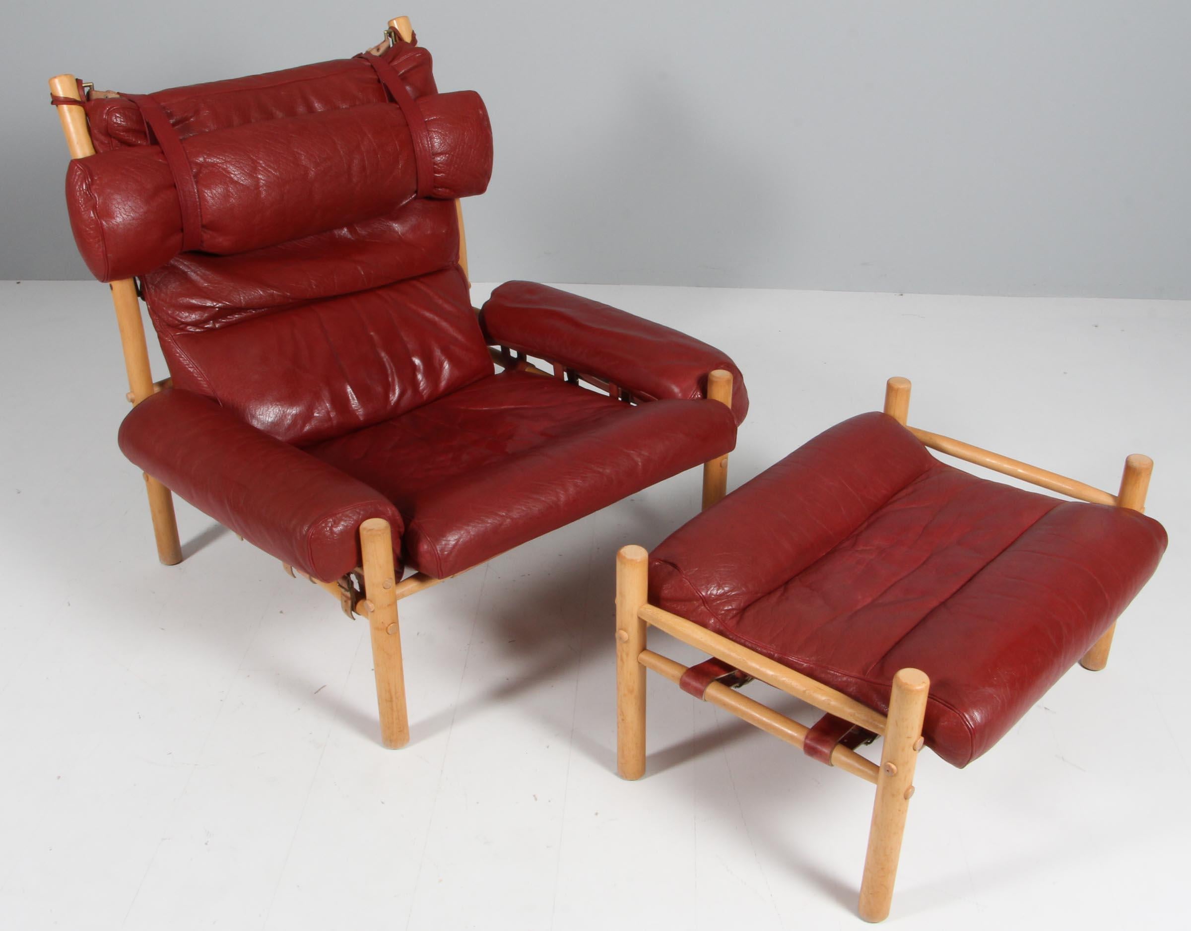 Arne Norell, 'Inca' lounge chair with ottoman, leather, beech, Sweden, 1965.

The iconic 'Inca' lounge chair with ottoman in original red leather, designed by Arne Norell. The back features thick buffalo leather. The red peather leather on the back