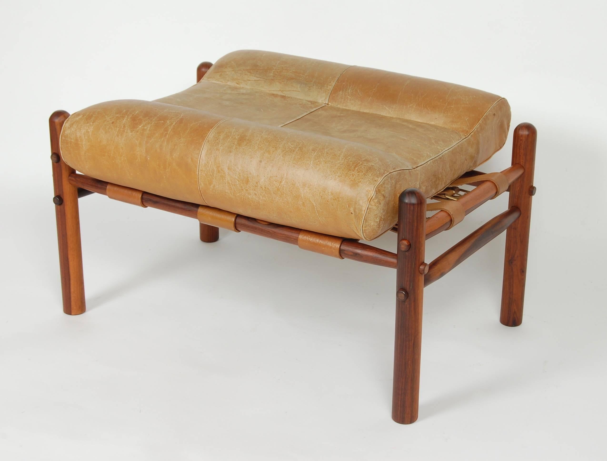 Rosewood and leather ottoman by Swedish designer Arne Norell, part of the Safari chair series he created in which the piece is designed to break down completely.
