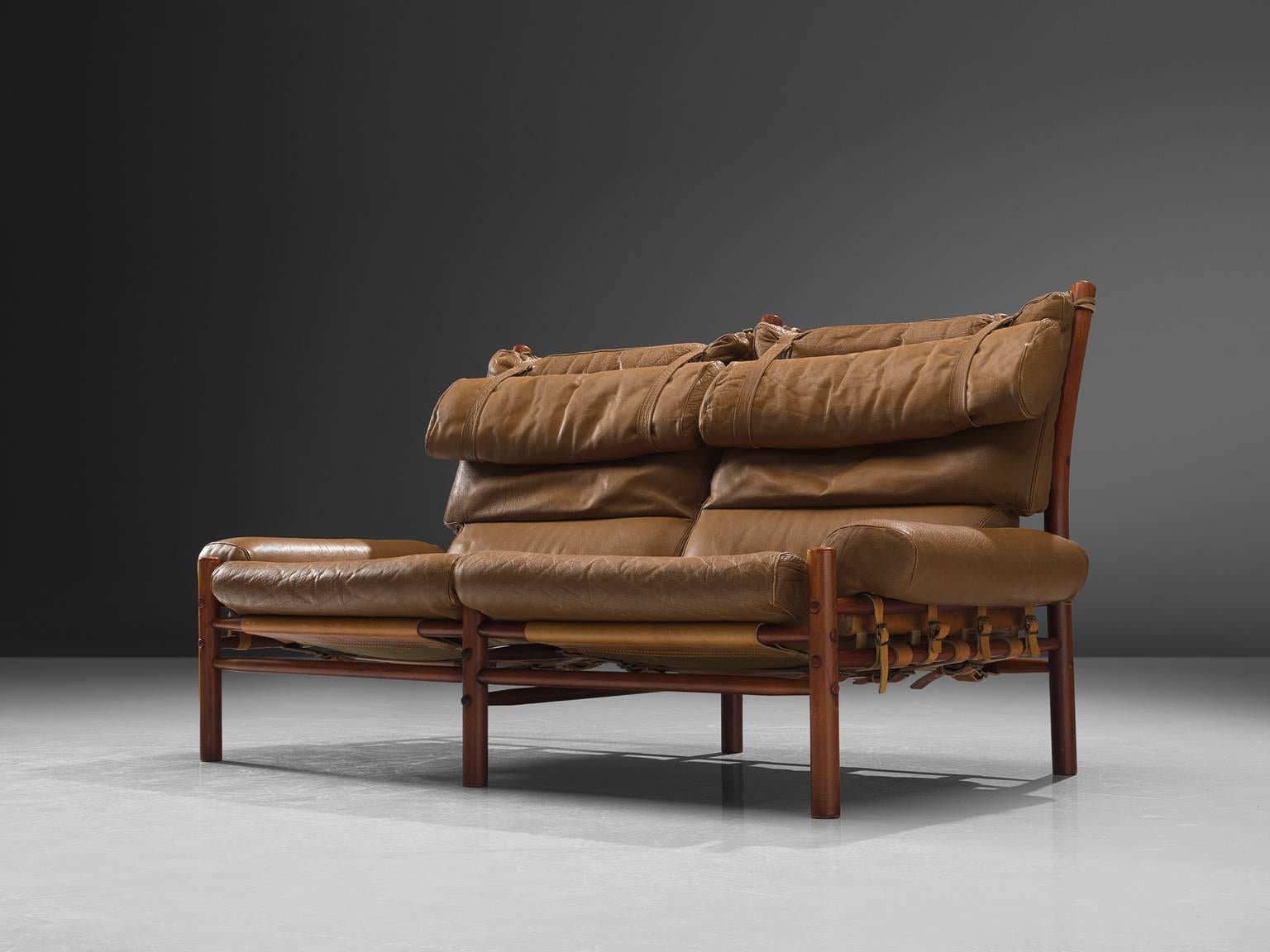 Arne Norell settee, leather, beech, Sweden, 1965.

This so called Inca sofa is designed by Arne Norell and manufactured by Norell Möbel, AB. The back features thick buffalo leather with some minor signs of wear. The light cognac leather on the back