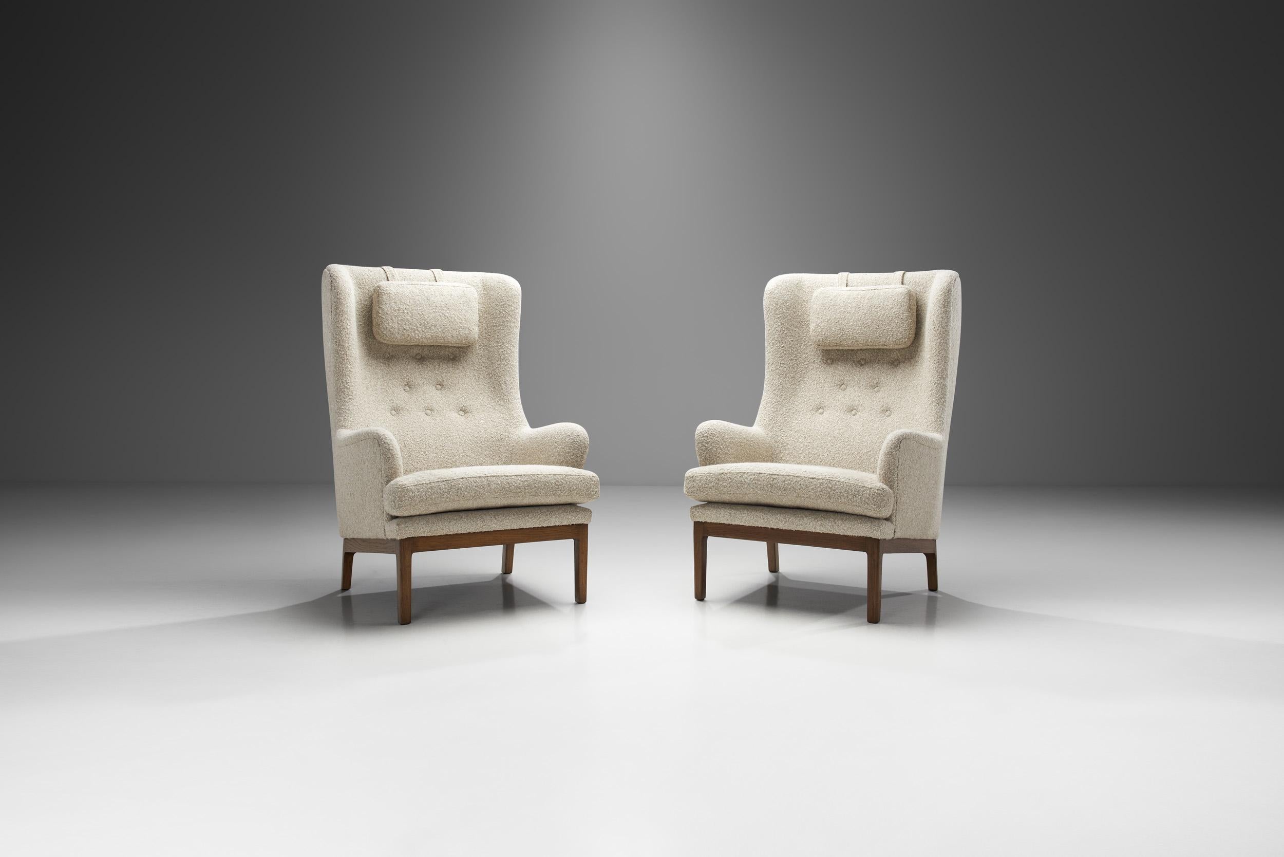 This pair of the “Krister” armchair model is a true Swedish design icon, and is among Arne Norell’s cosiest works. These high-back armchairs’ comfort is only rivalled by their stylishness and elegance. Arne Norell was a household name within the