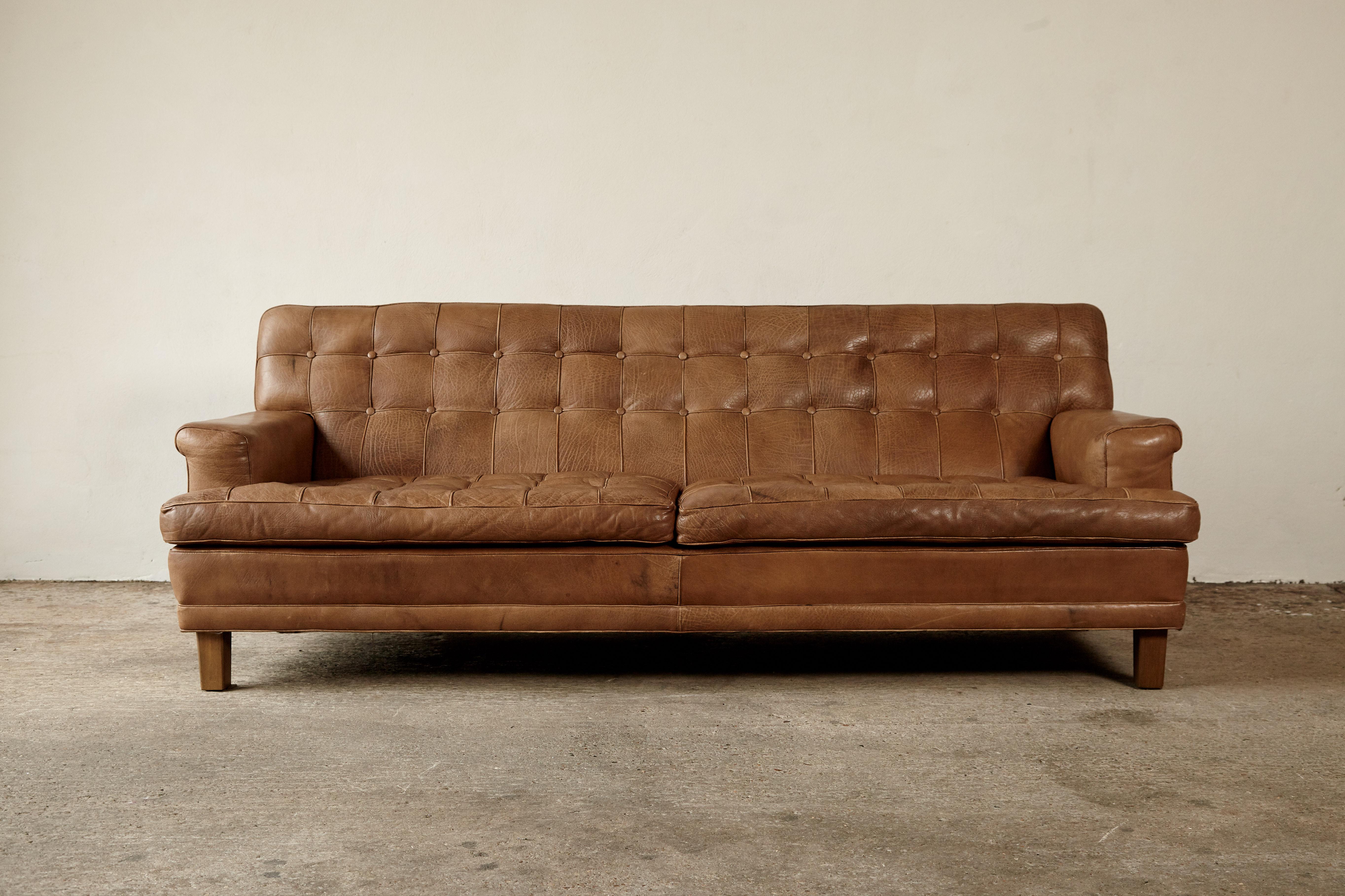 Stunning Arne Norell leather Merkur / Mexico sofa, Sweden, Norell Mobel, 1970s in cognac colored buffalo leather.    Lovely vintage condition with a wonderful patina and tone.   Ships worldwide - please contact us for options.