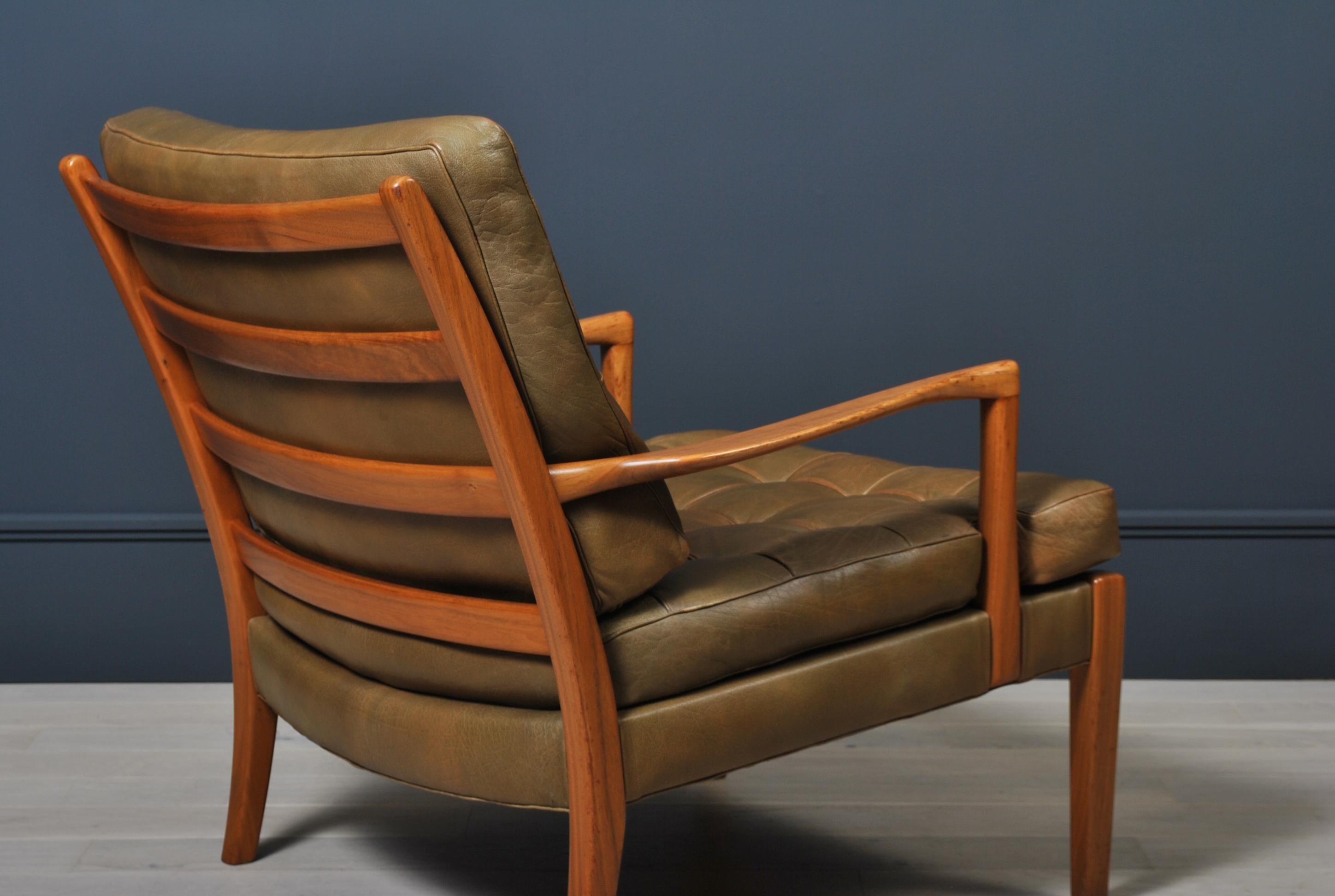 Wonderful example of the Arne Norell lounge chair, model ‘Loven’.
Walnut frame with lovely coloured Buffalo hide leather upholstery. 
Produced by Arne Norell, Sweden circa 1960.