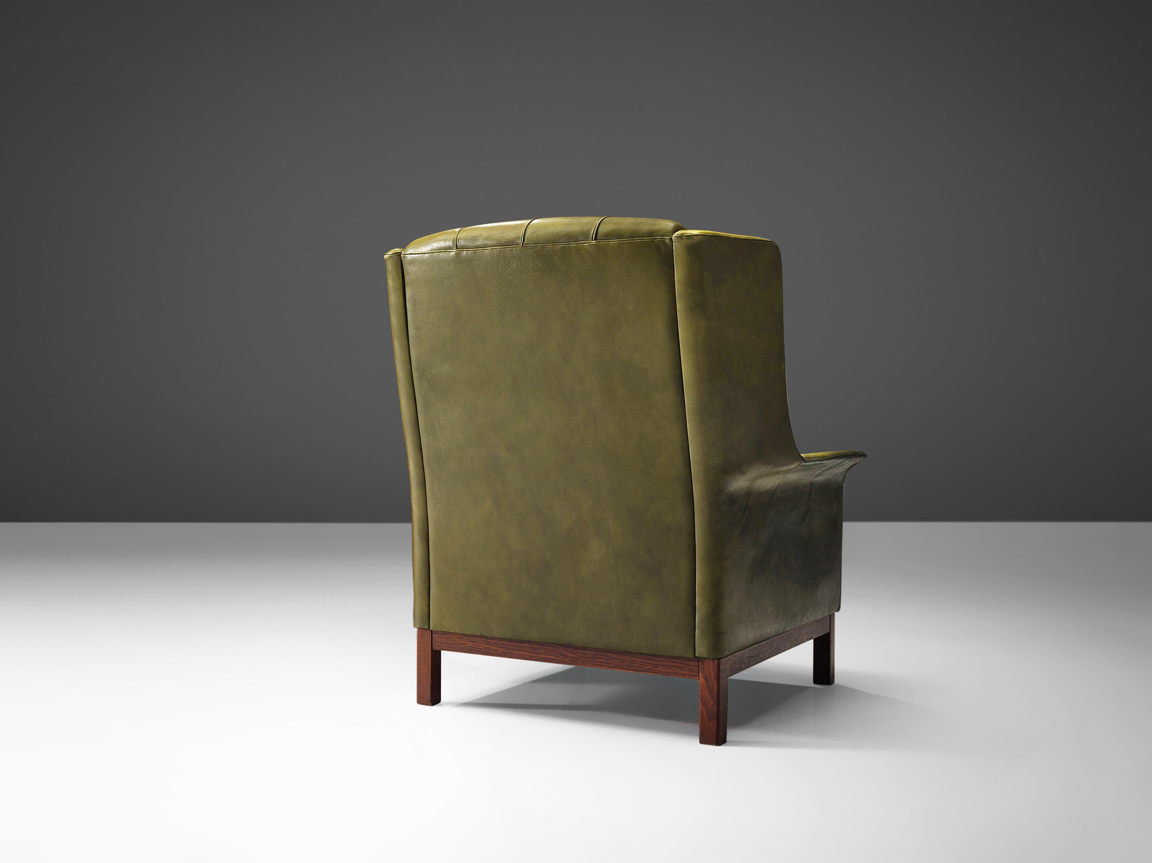 green leather lounge chair