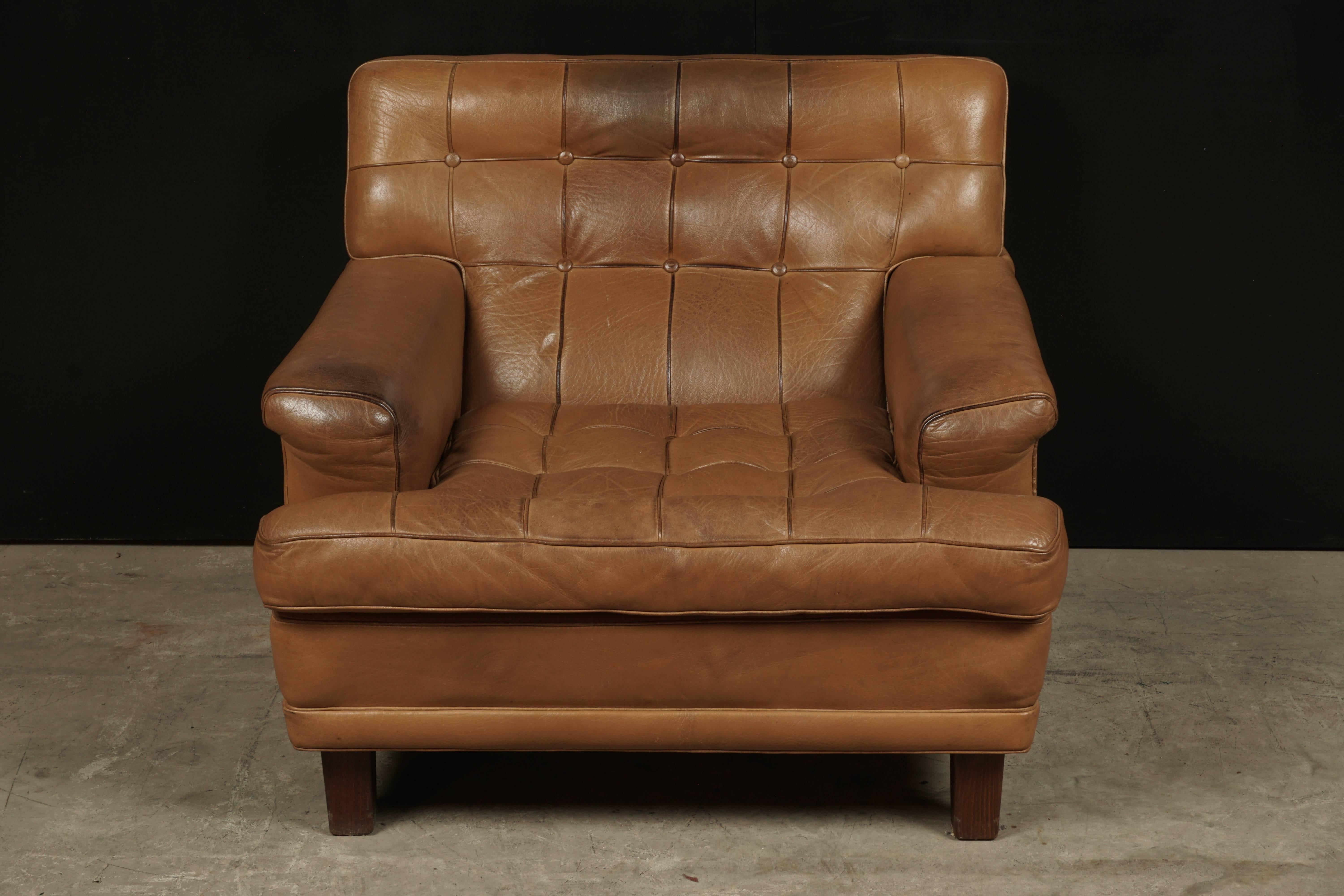 Arne Norell lounge chair Model Merkur, Sweden, circa 1960. Original cognac buffalo leather upholstery. Manufactured by Norell Möbel AB.