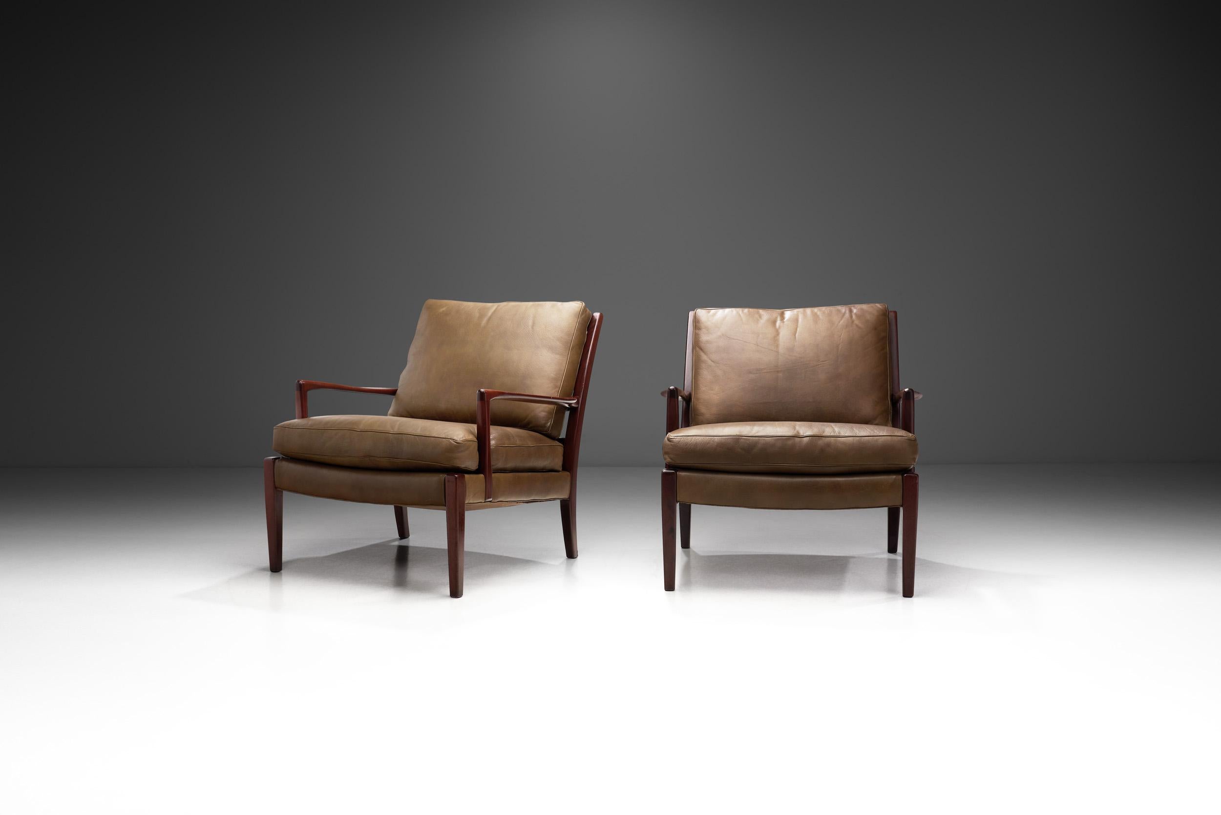 Swedish designer, Arne Norell’s conceptual designs gained recognition for their usage of traditional materials and forms like leather and wood combined with simple and vanguard lines. This pair of “Löven” chairs was designed by Arne Norell in 1964