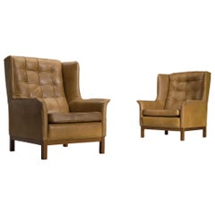 Arne Norell Matching Pair of High Back Chairs in Patinated Cognac Leather