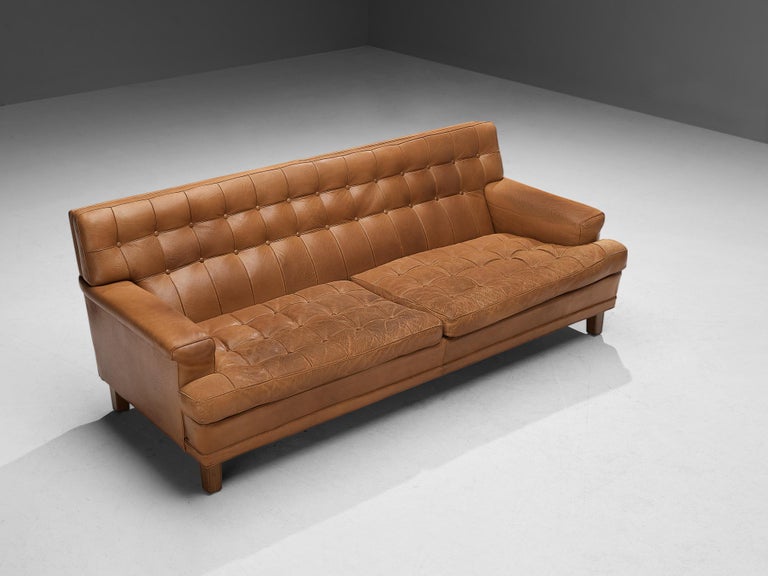 Arne Norell for Norell Möbel AB, sofa model 'Merkur', leather, wood, Sweden, 1960s 

This high-quality sofa called ‘Merkur’ is designed by the talented Swedish designer Arne Norell (1917-1971). Characteristic for this model is the notable space